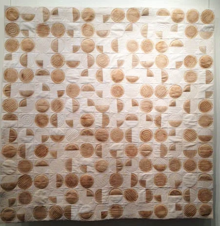 A lovely geometric quillt made with coffee filters!