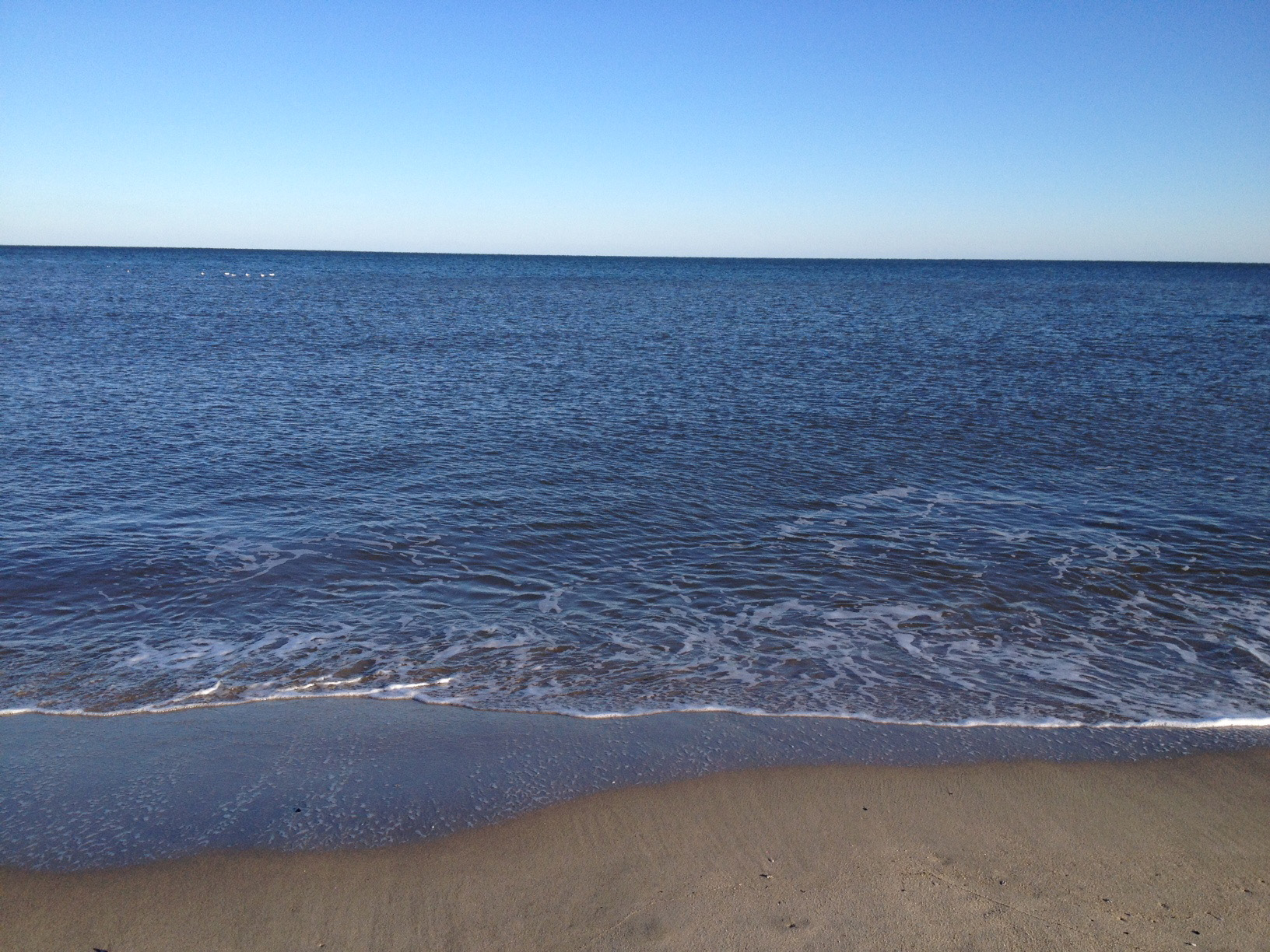 Flat, calm, ocean before the storm. 