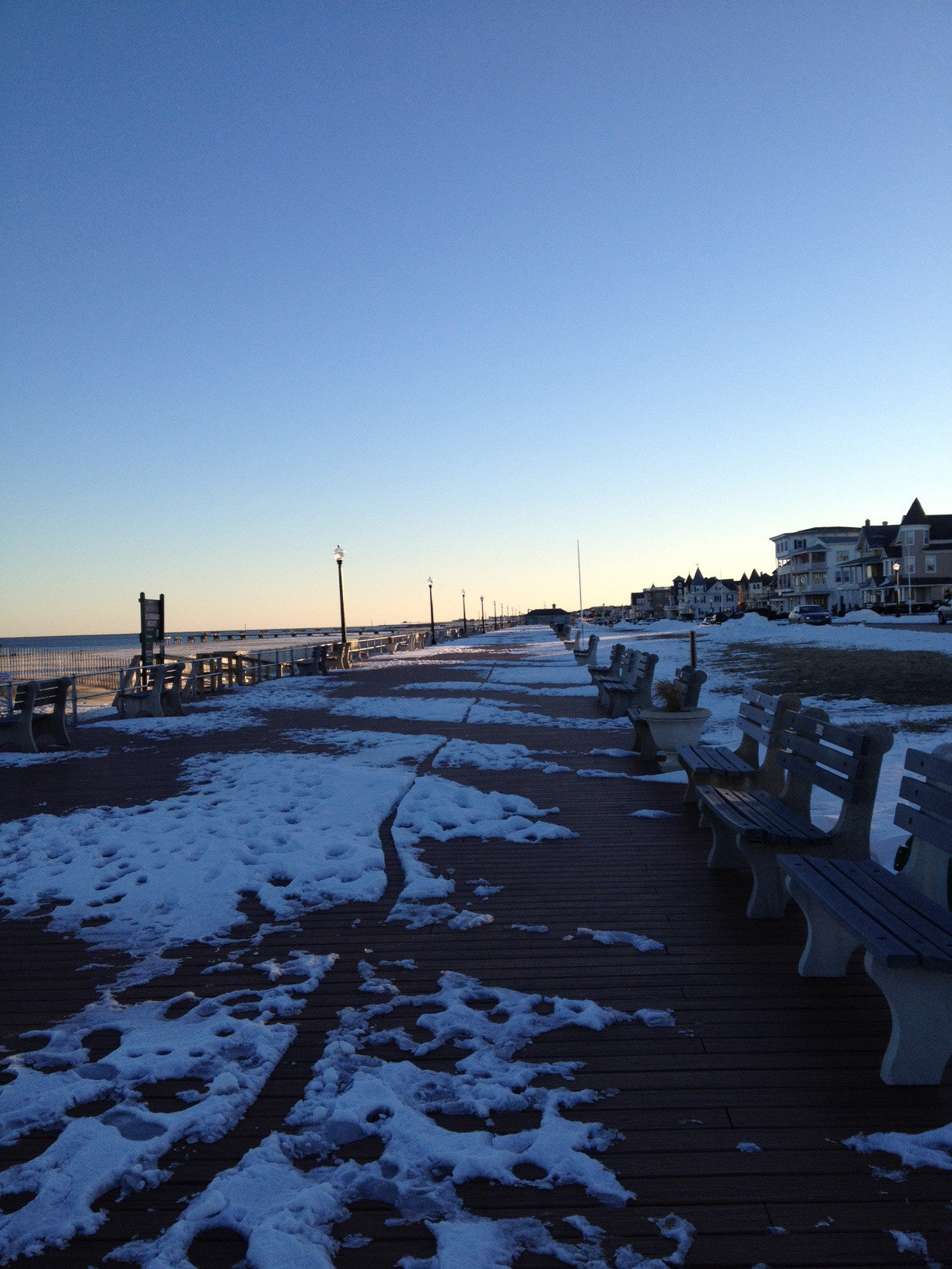 Sun sets over the boardwalk. 