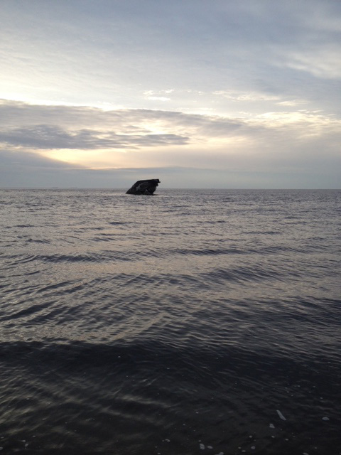 Ship wrecks at sunset.