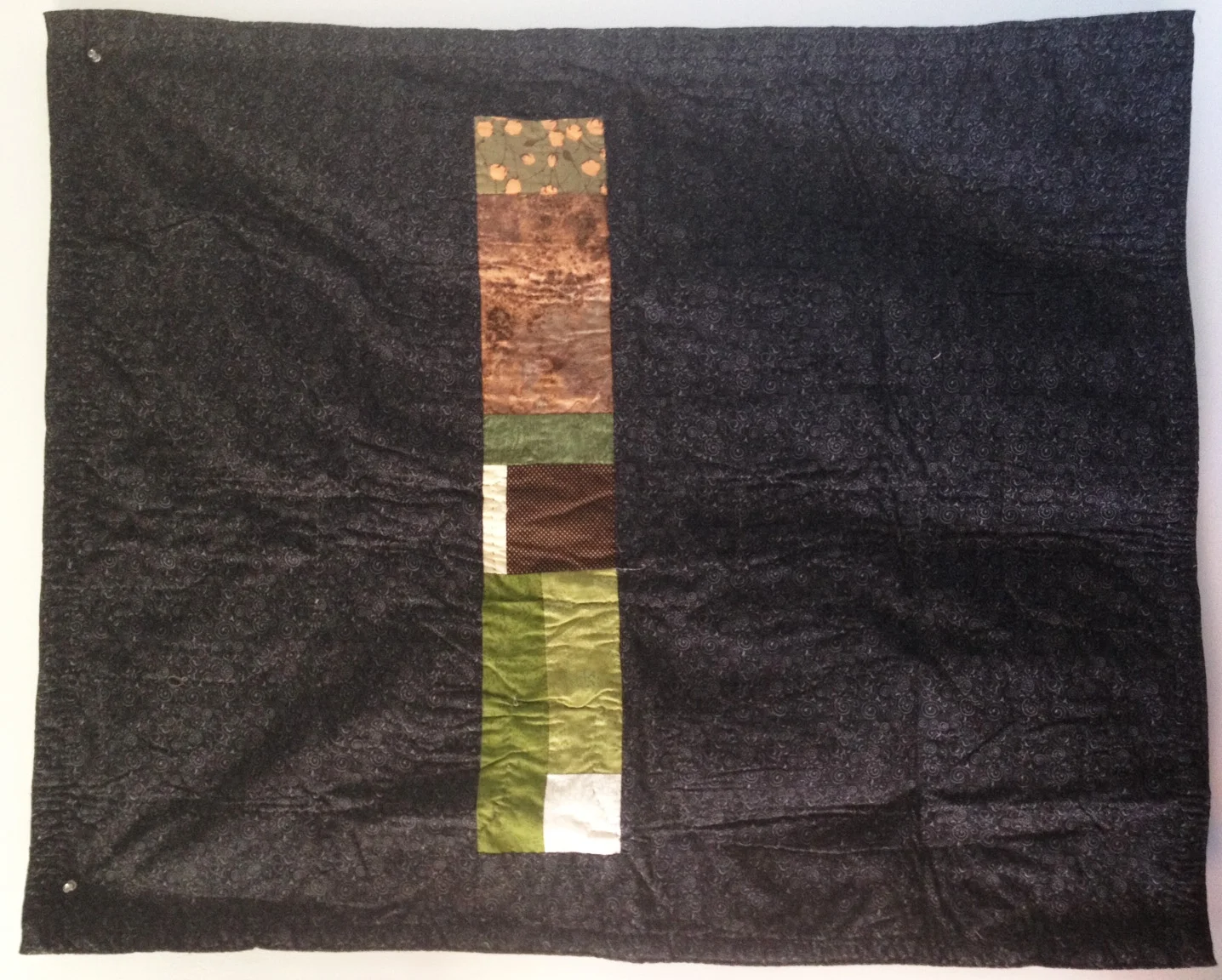 Here are the quilt front and back after I photographed them many years ago before gifting. 