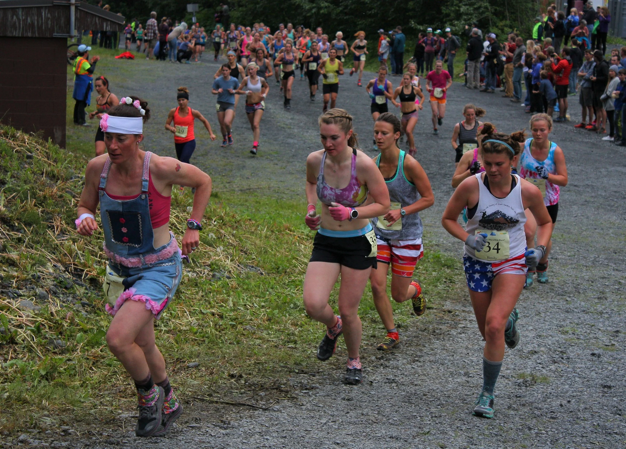 Aubrey Smith, left, known for her denim get-ups, leads a pack of ladies up Mount Marathon for the annual Fourth-of-July race this year.