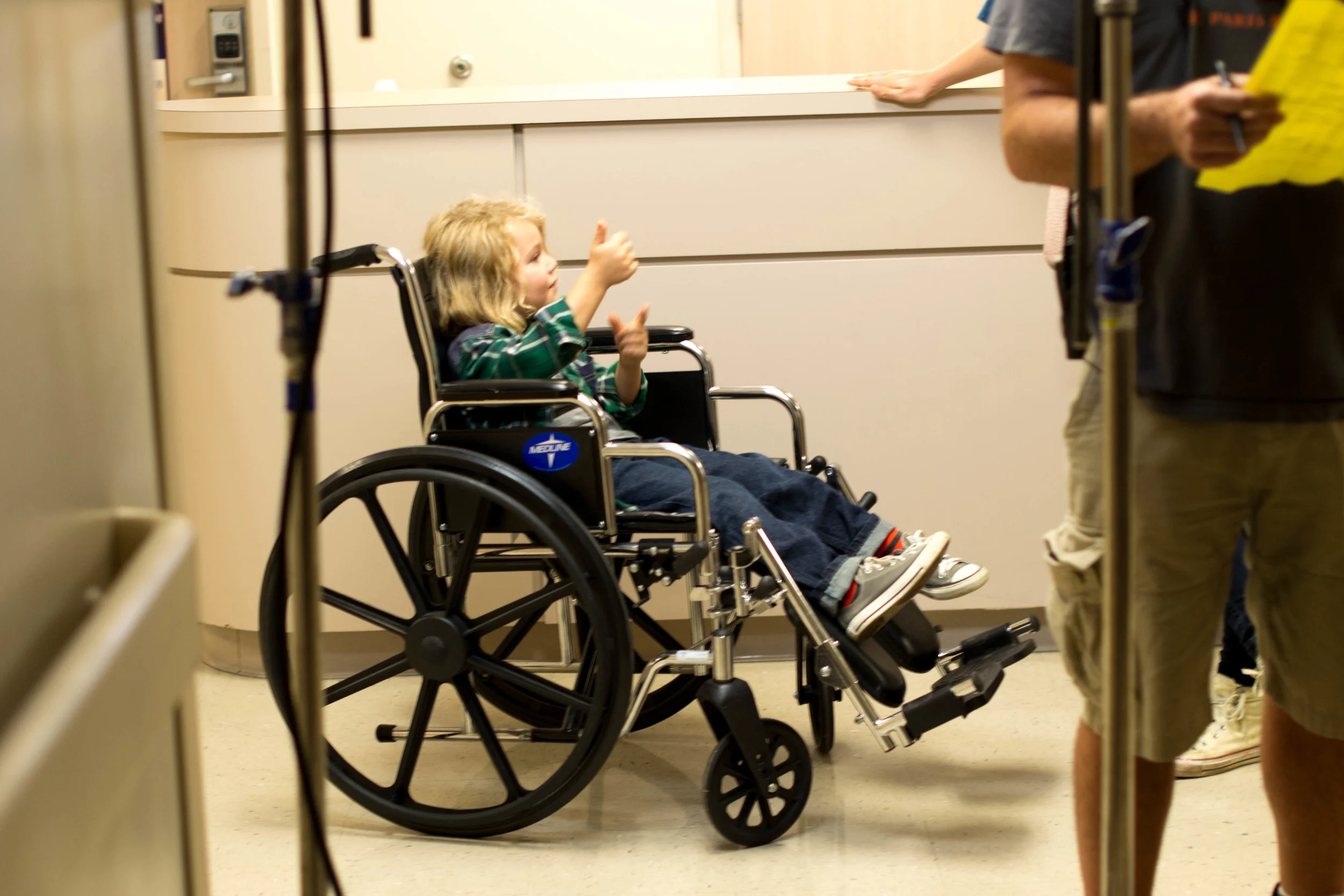 Presley fooling around in the prop wheelchair in between takes.