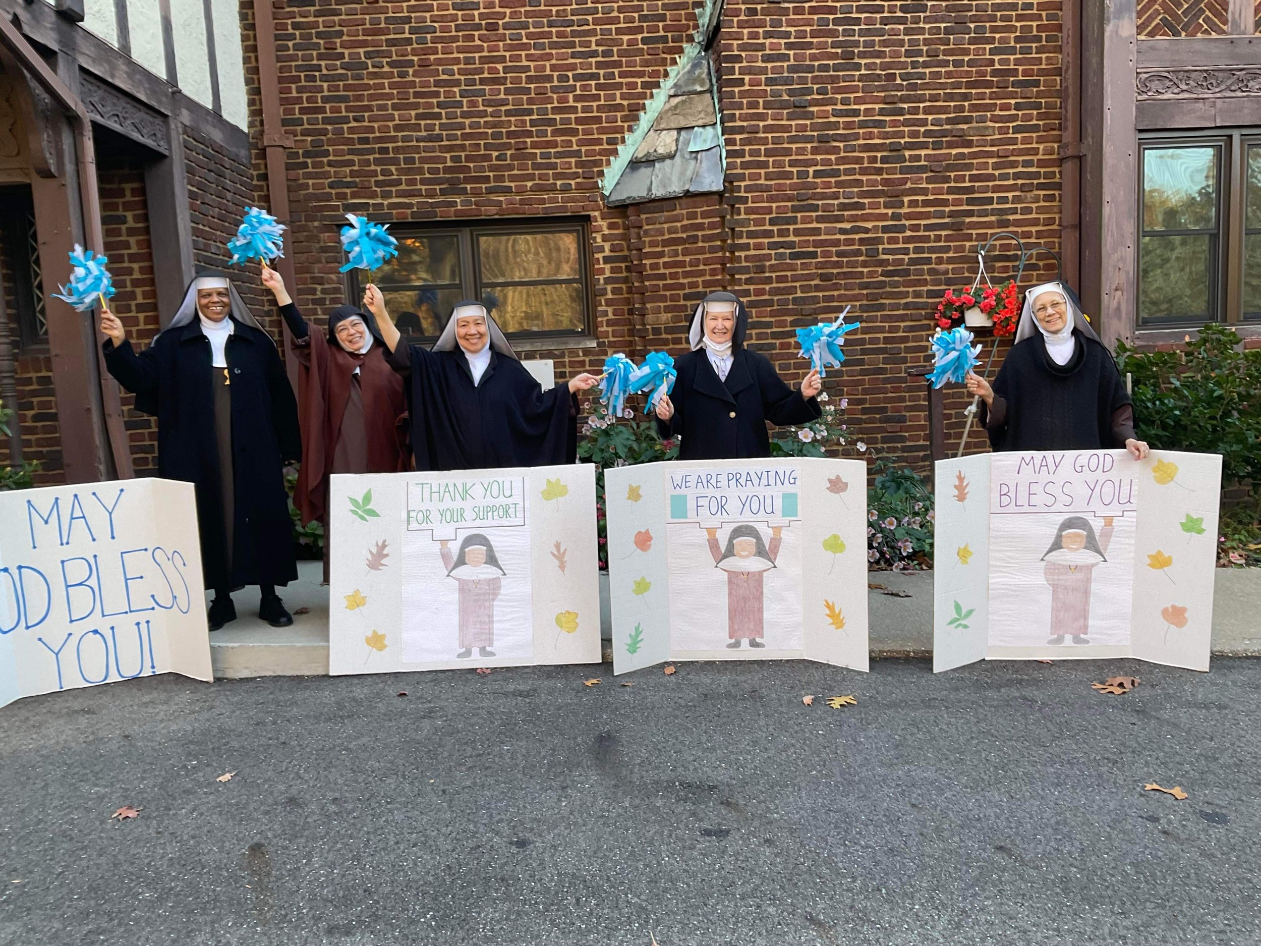 The Professed Sisters cheering on the 2022 Nun Run participants...I still think the Formation Sisters had more fun with this though