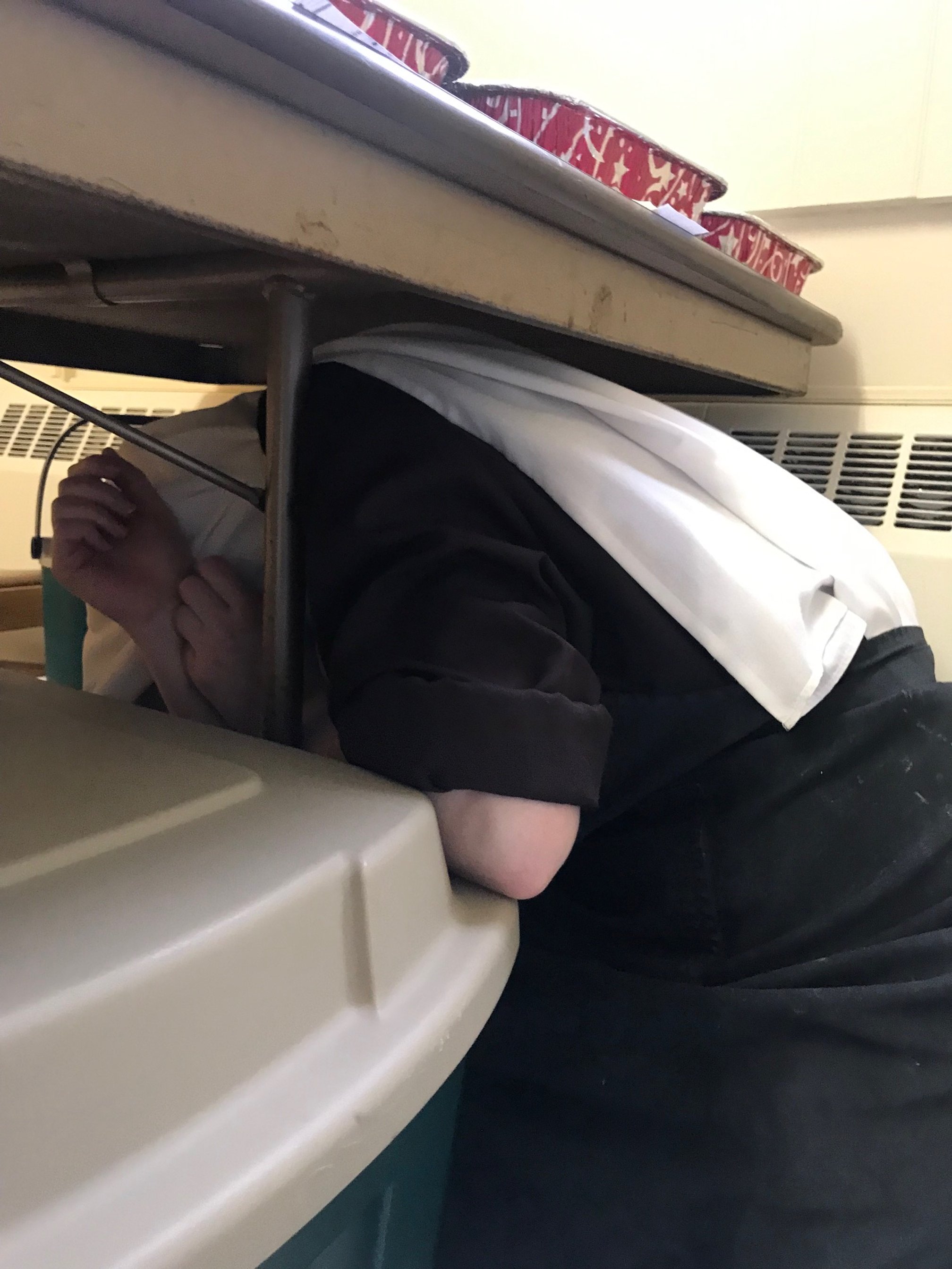 Sr. Therese Marie "hiding" from Mother as she comes in to inspect our cookie distribution...she was found and maybe with evidence that condemned her