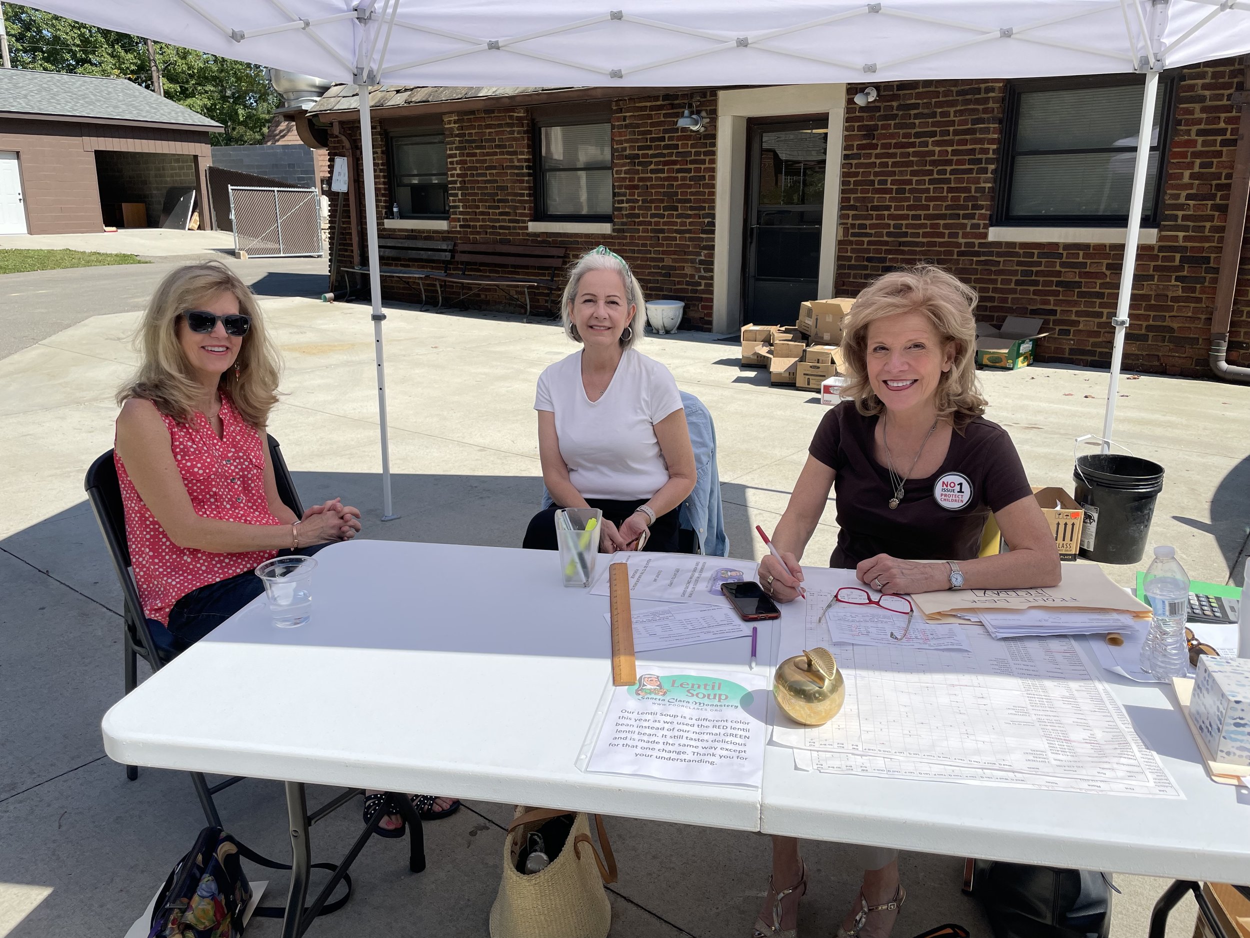  One of our “paid” side sets of volunteers taking a breather before another rush: Nancy, Marsha, and Janet. 