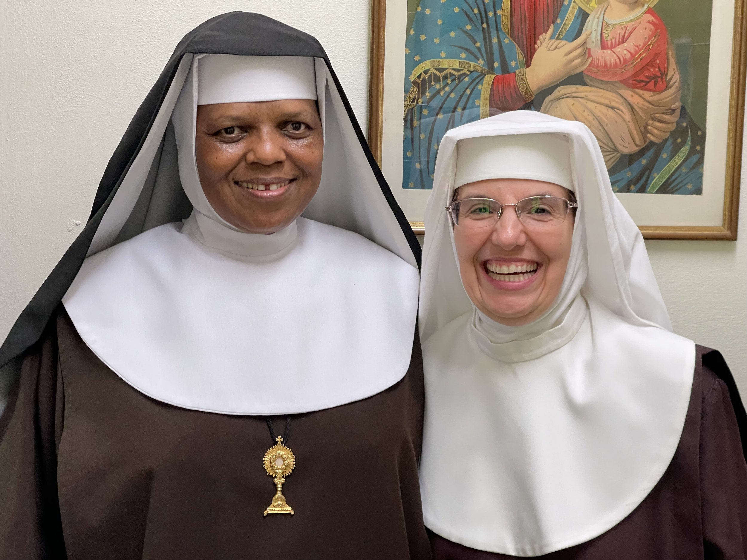 Sr. Mary Agnes and a radiant Sr. Mary Faustina on the day of her investiture...as it is so hard to not call novices by their old names we have to sail 4 Hail Marys for them when we do.
