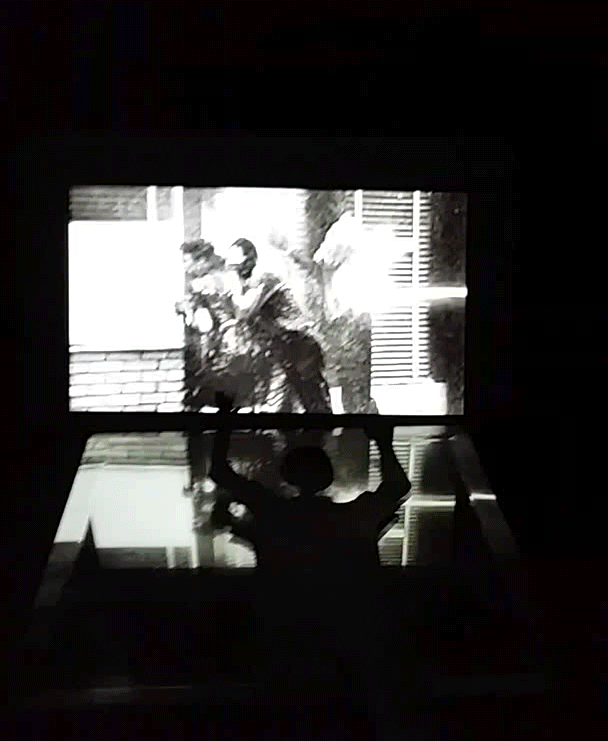 Gif of what is shown inside the box- images from cellphone footage and historical protests with construction paper cut outs taken from headlines and stills from Eric Garner's murder.
