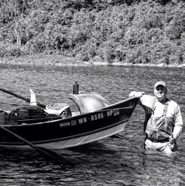 John with a boat he happened to see on a river.