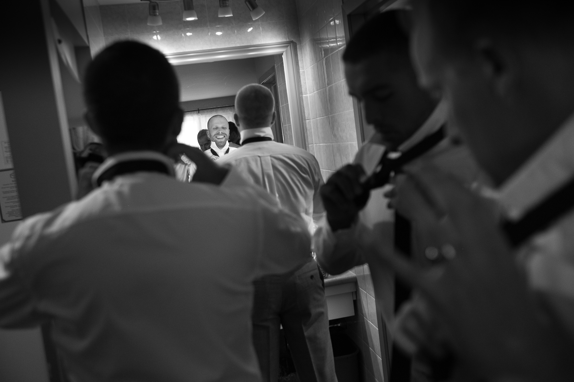 Jeff and his groomsmen get ready in their hotel room at the Hessenland Inn.