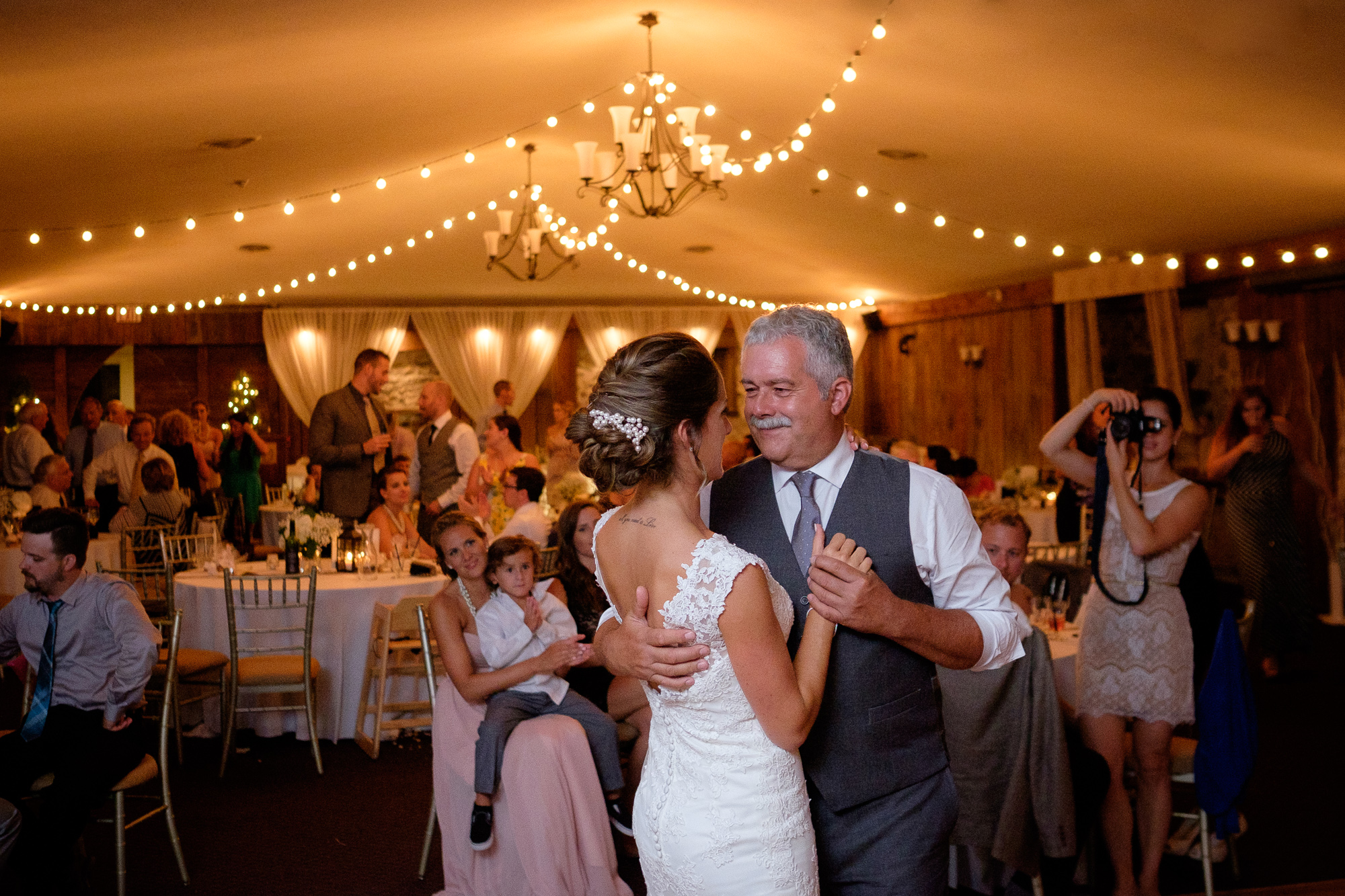  The bride dances with her father during the wedding reception at the Hessenland Inn 