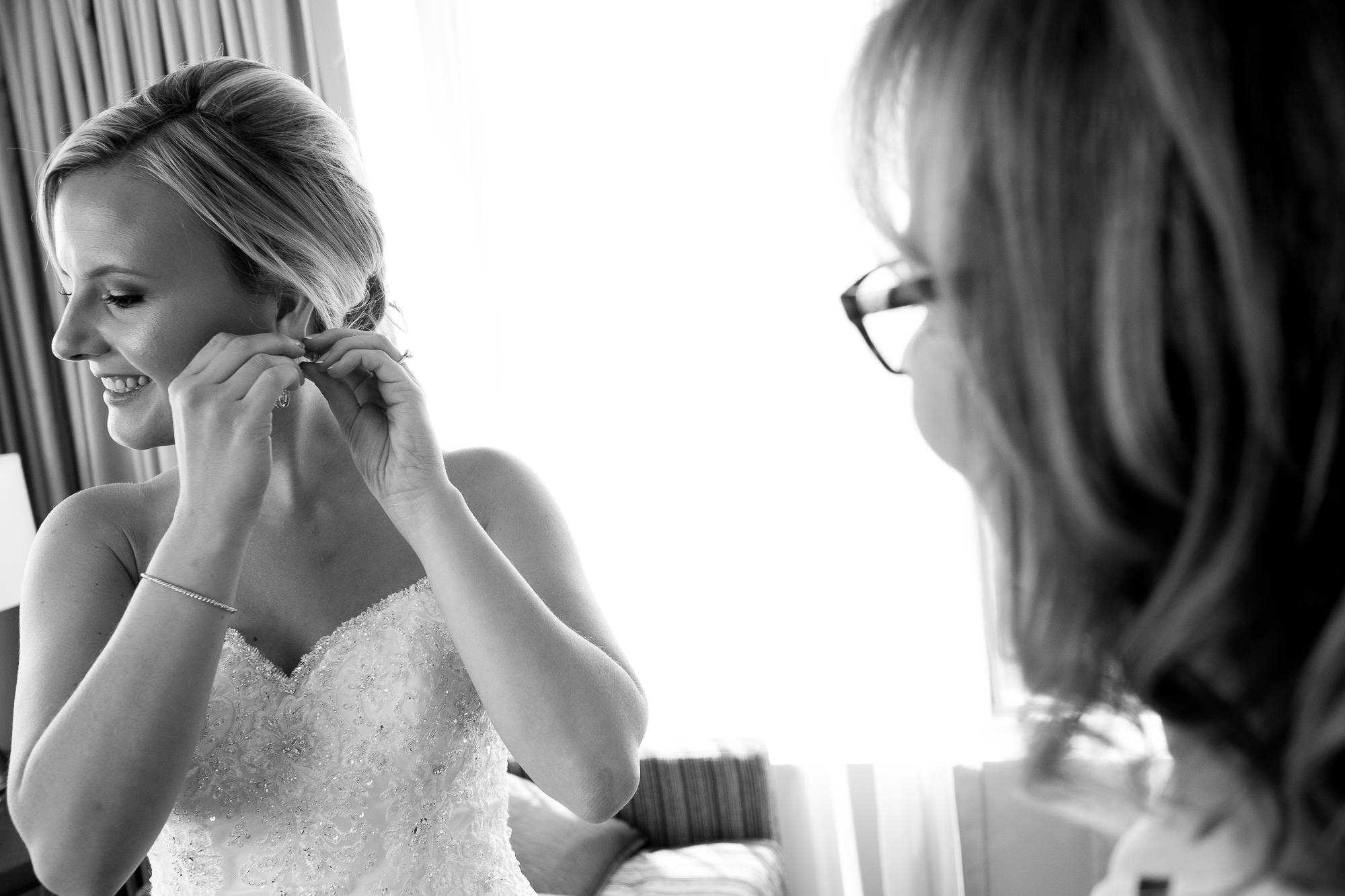  Danielle adjusts her earring as she gets ready for her wedding ceremony at the One King West Hotel in Toronto. 