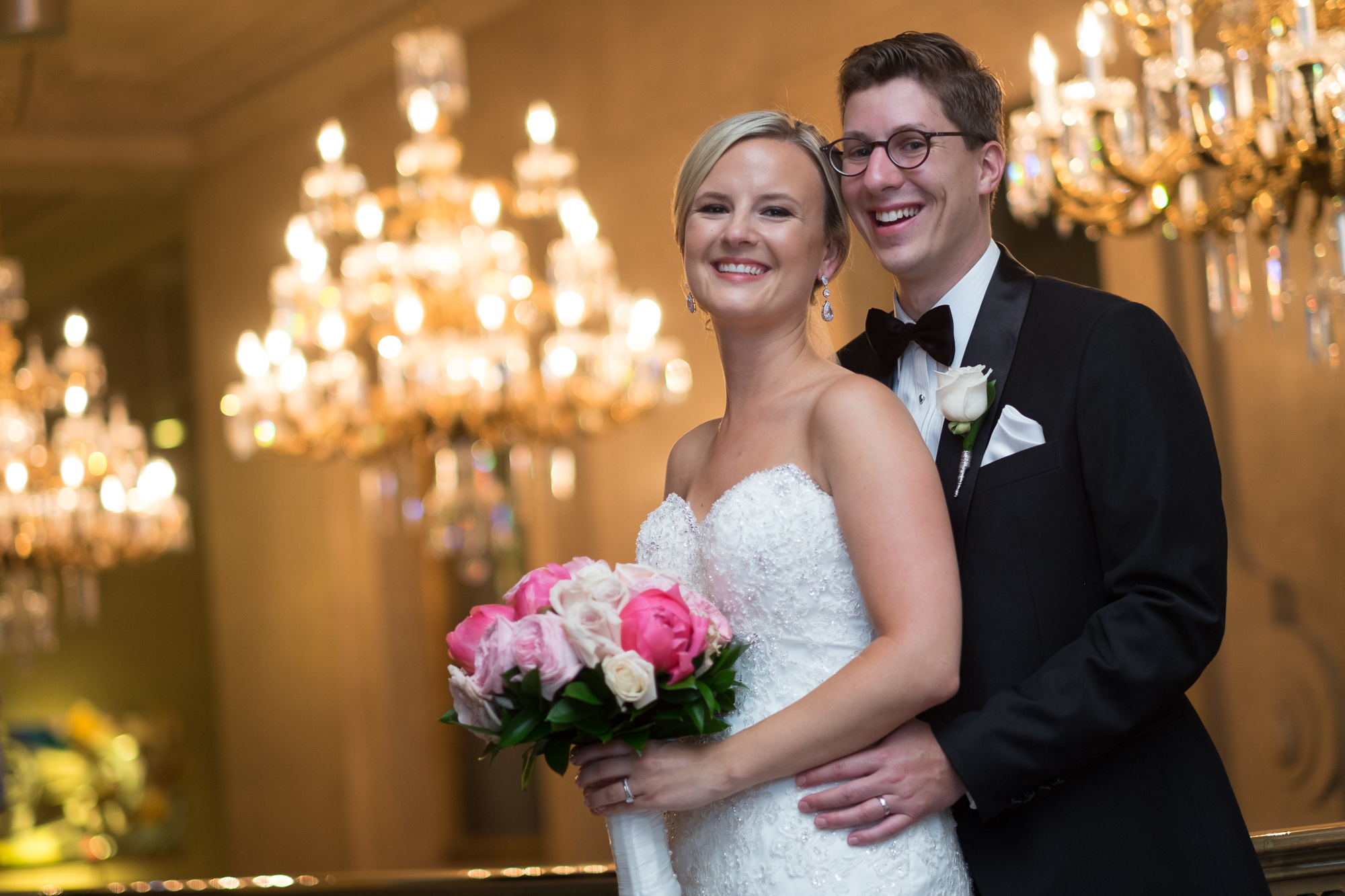  Danielle and Eric pose for a portrait before entering their wedding reception at the One King West Hotel in Toronto. 