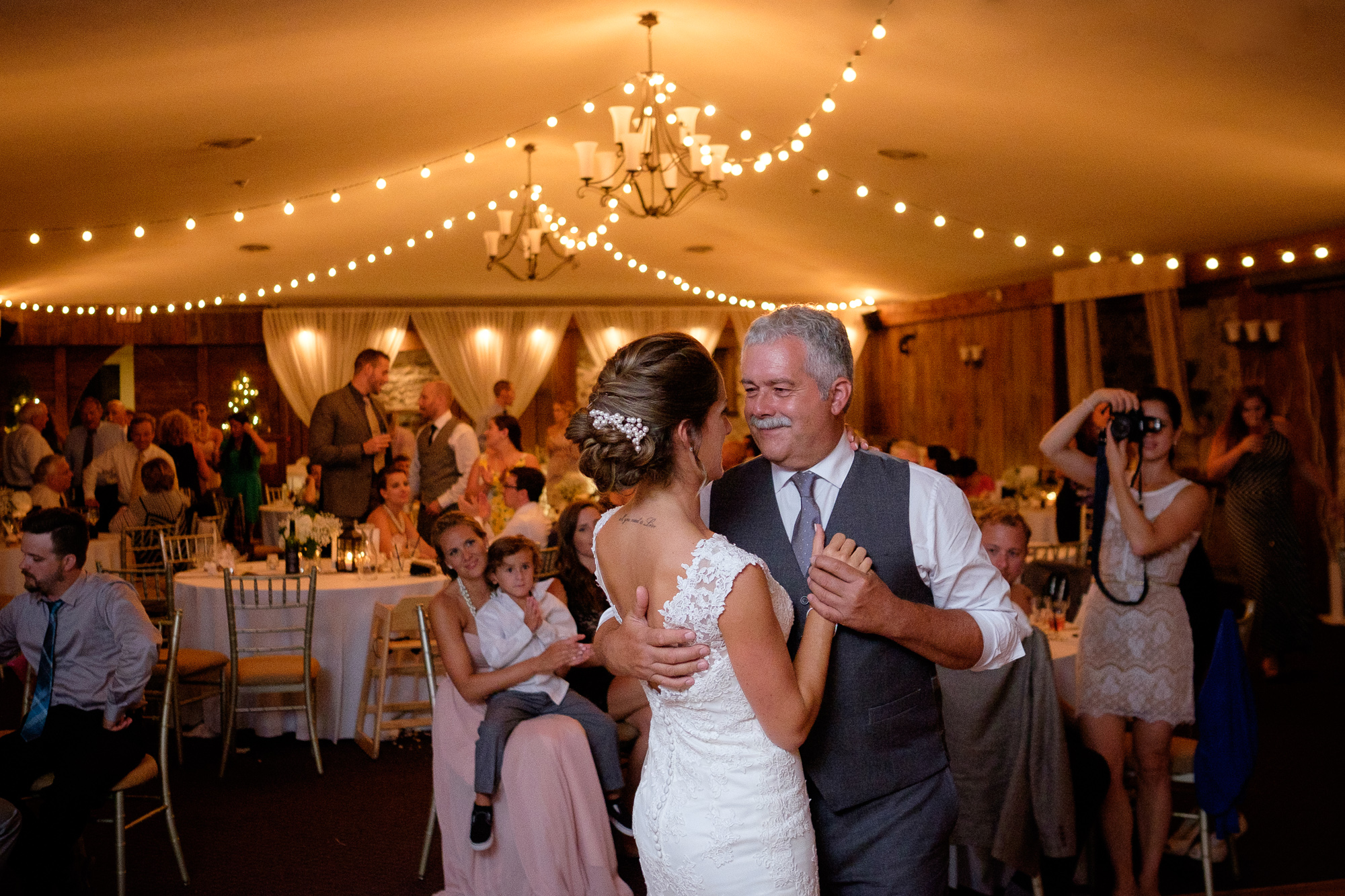  Here's another one from Rebecca + Jeff's wedding at the Hessenland Country Inn (what can I say, it was &nbsp;great wedding!)  I like everything about this picture... the look on Rebecca's father's face as he dances with his daughter... the guests lo