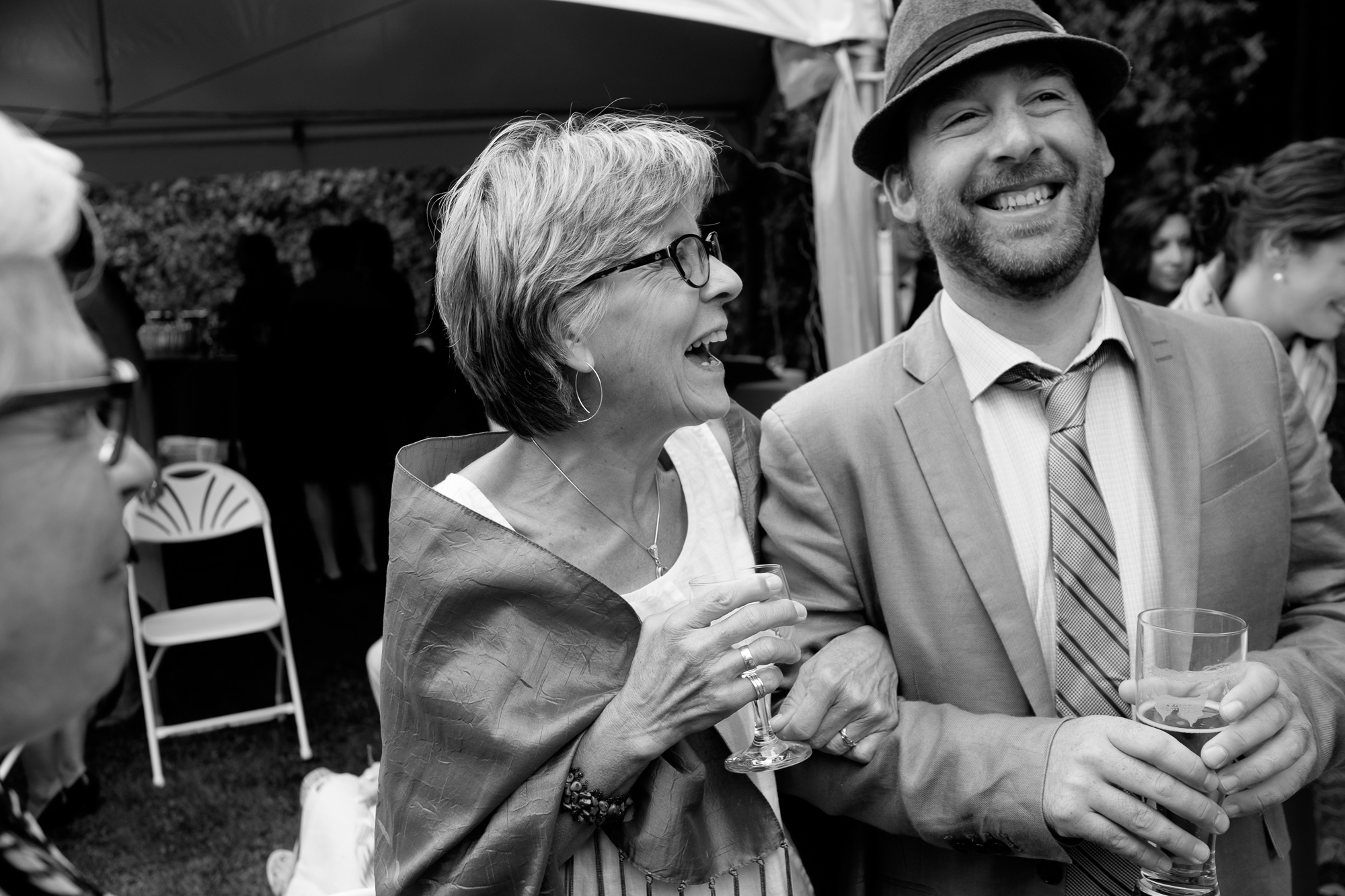 Joel's mom shares a laugh with the wedding MC during the cocktail hour at their wedding in Tobermory.