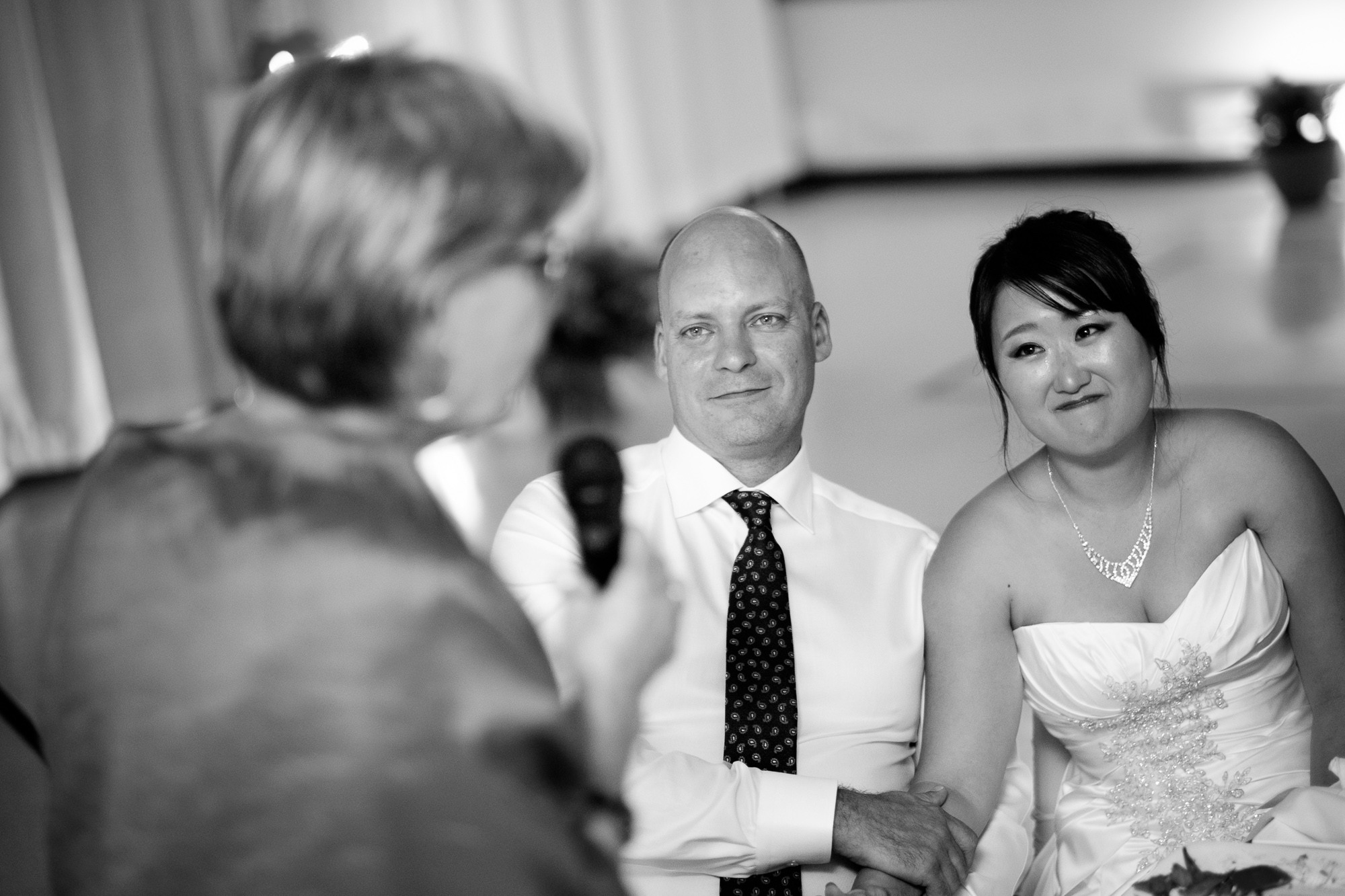  Joohee + Joel look on as Joel's mom gives her speech during the wedding reception in Tobermory.&nbsp; 