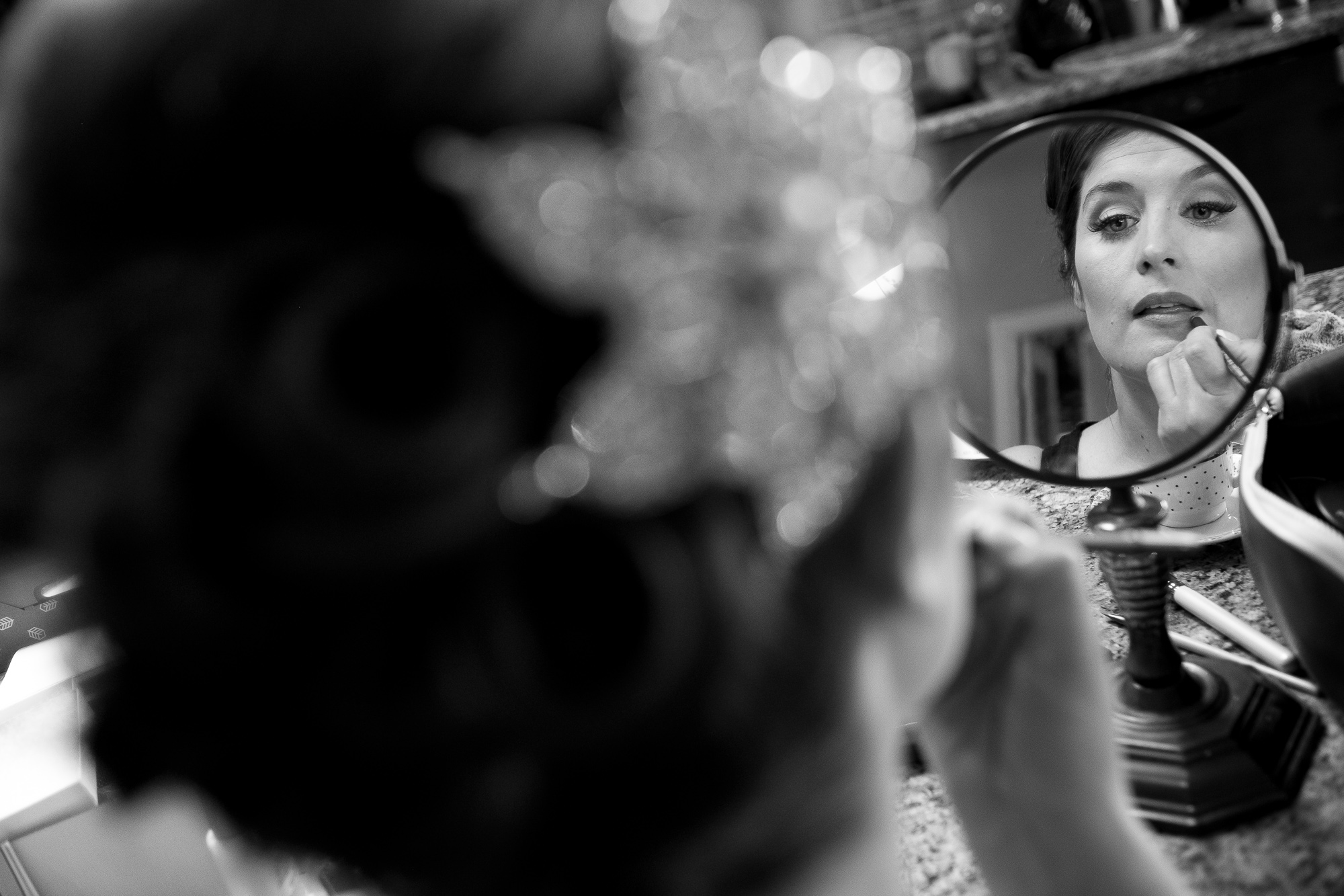  Joanna adjusts her make up before putting her wedding dress on before her wedding ceremony. 