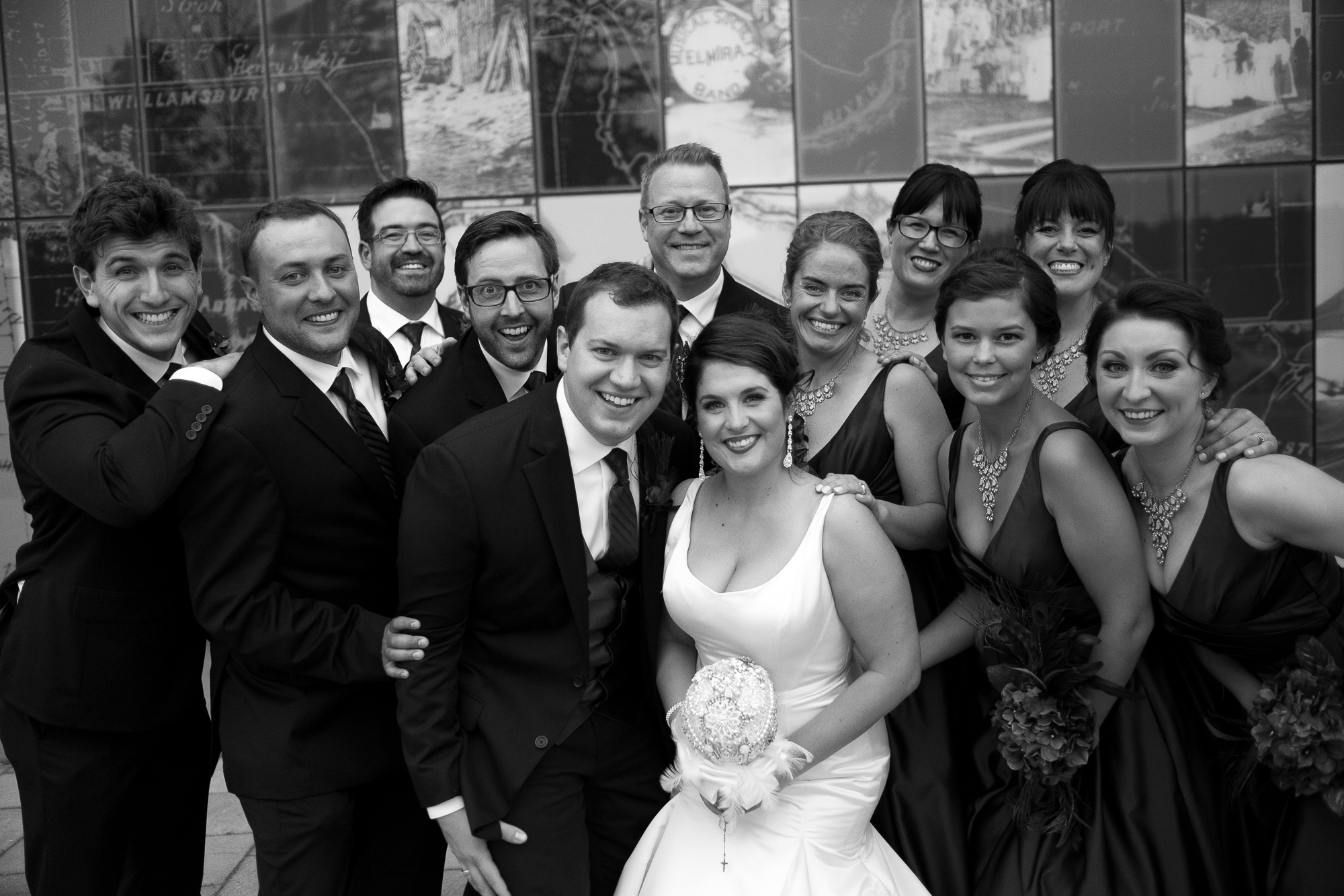 Joanna + Kris pose with their wedding party for a portrait during the reception at the Waterloo Region Museum.