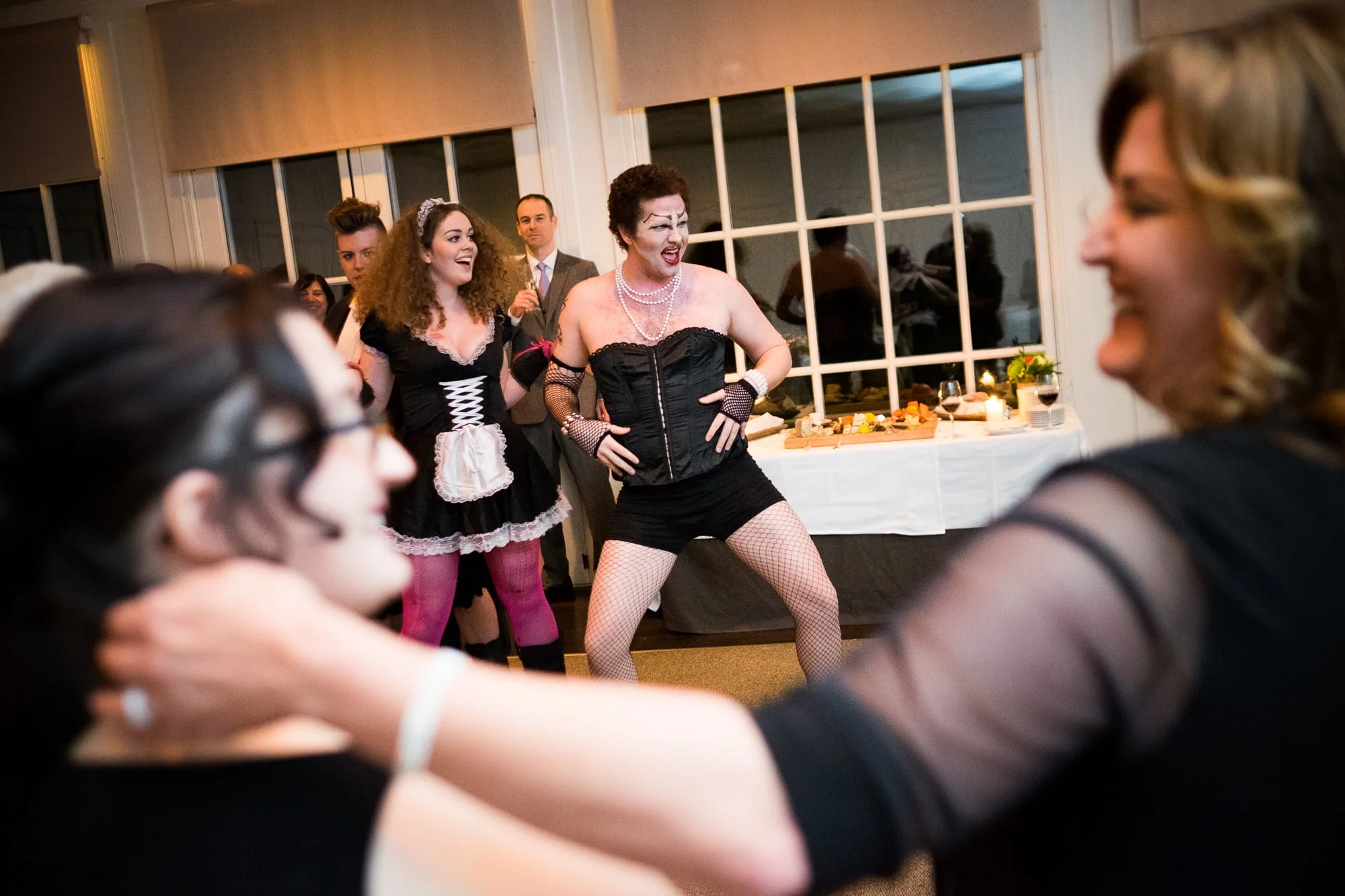 Renee + Senem enjoy a performance by the cast of Rocky Horror Picture Show during their wedding reception at Langdon Hall in Cambridge, Ontario.