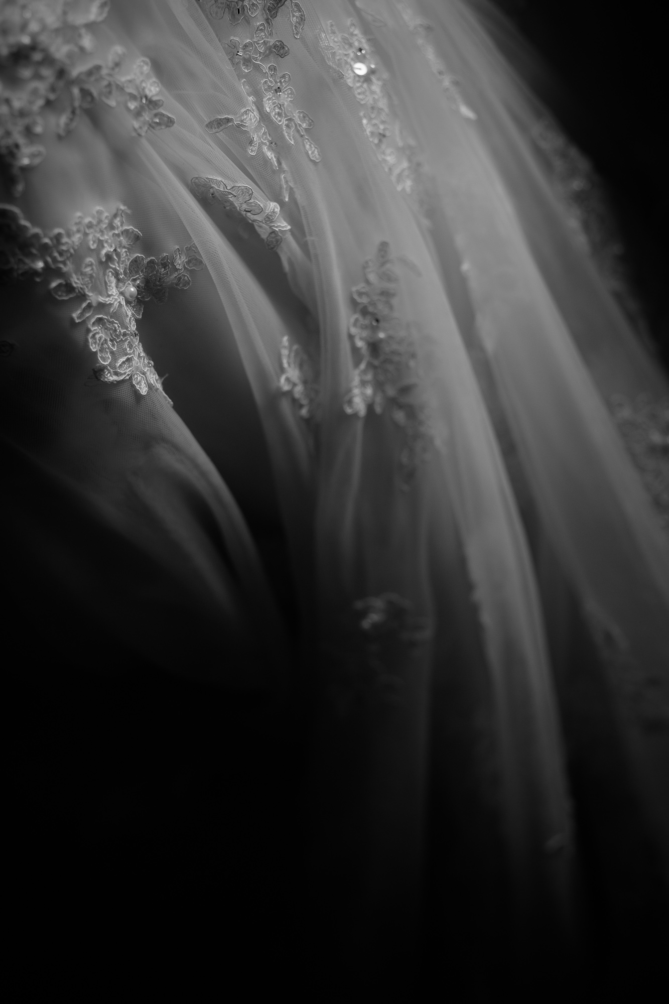  A black and white detail photograph of Jennifer's wedding dress from her Toronto wedding. 