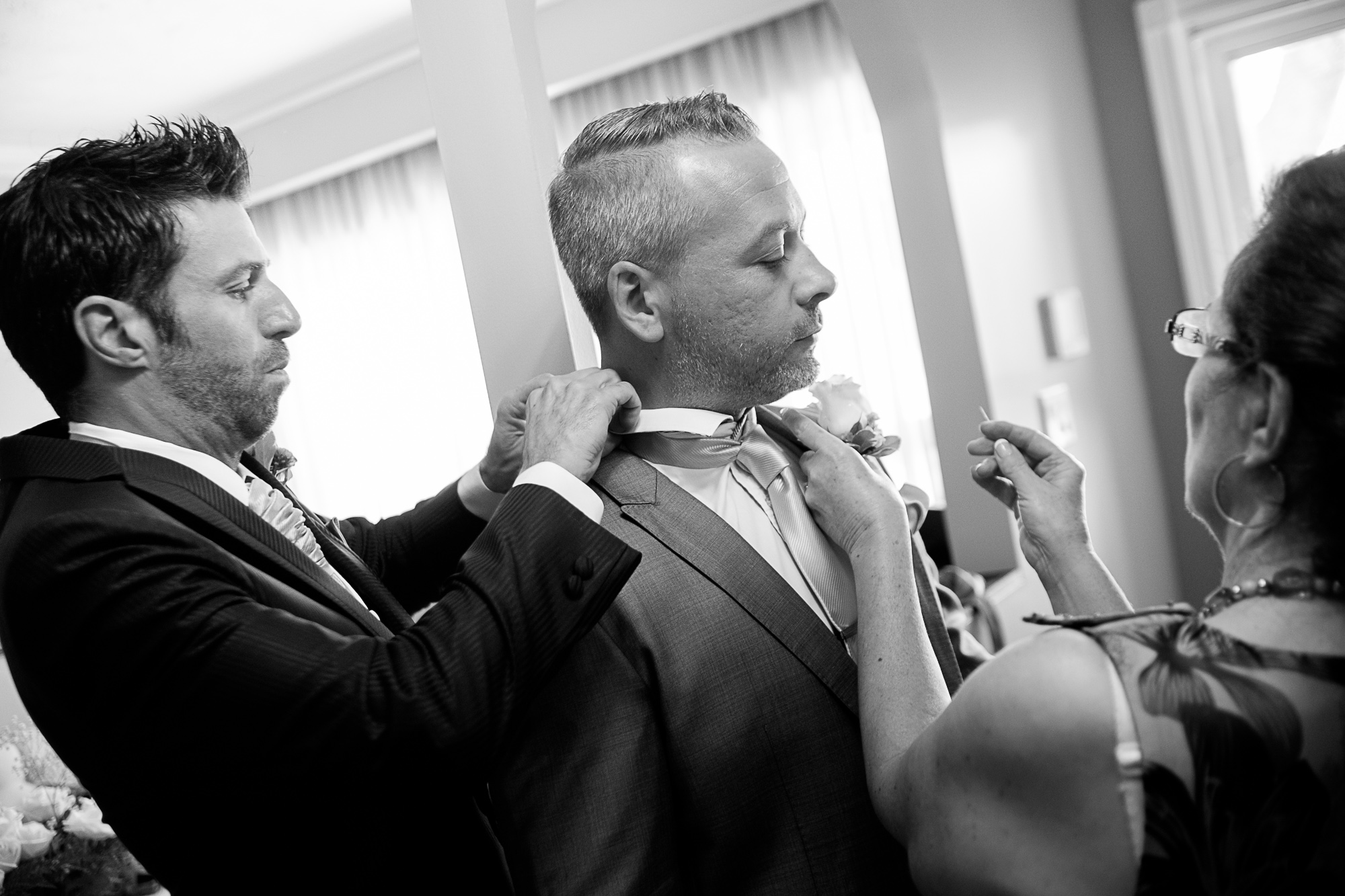  Theo and his mom help the best man getting ready before their Toronto wedding. 