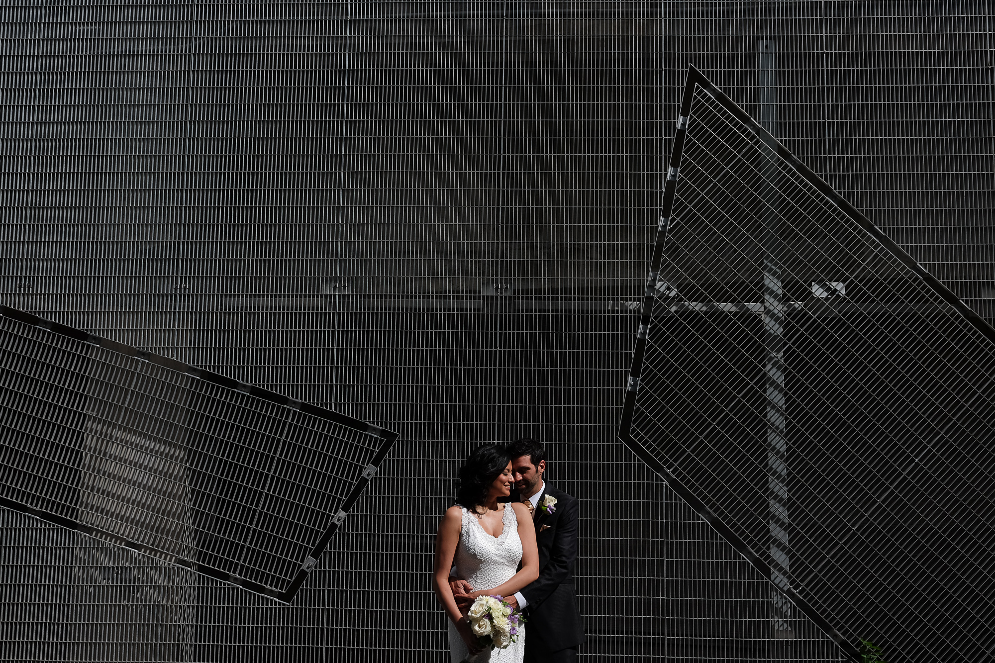  Maria + Theo pose for a midday wedding portrait just outside the Art Gallery of Ontario in Toronto. 