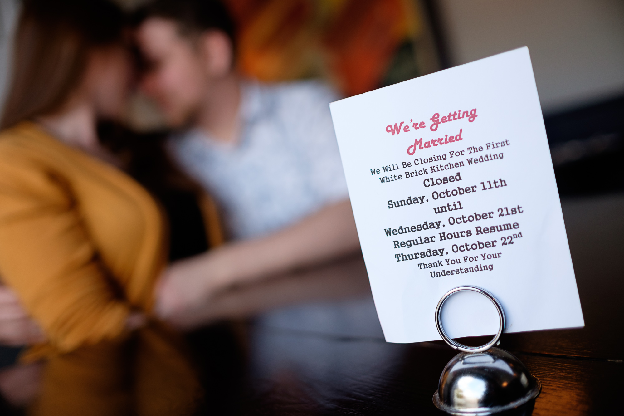An engagement photograph from Haley + Stephen's engagement pictures in their restaurant in Toronto.