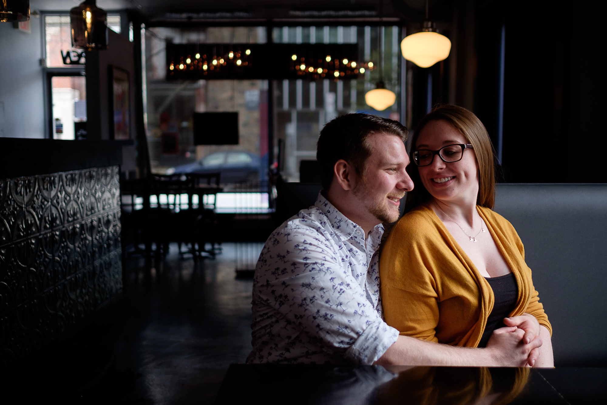  A restaurant engagement photograph from Haley + Stephen's downtown Toronto engagement session.&nbsp; 