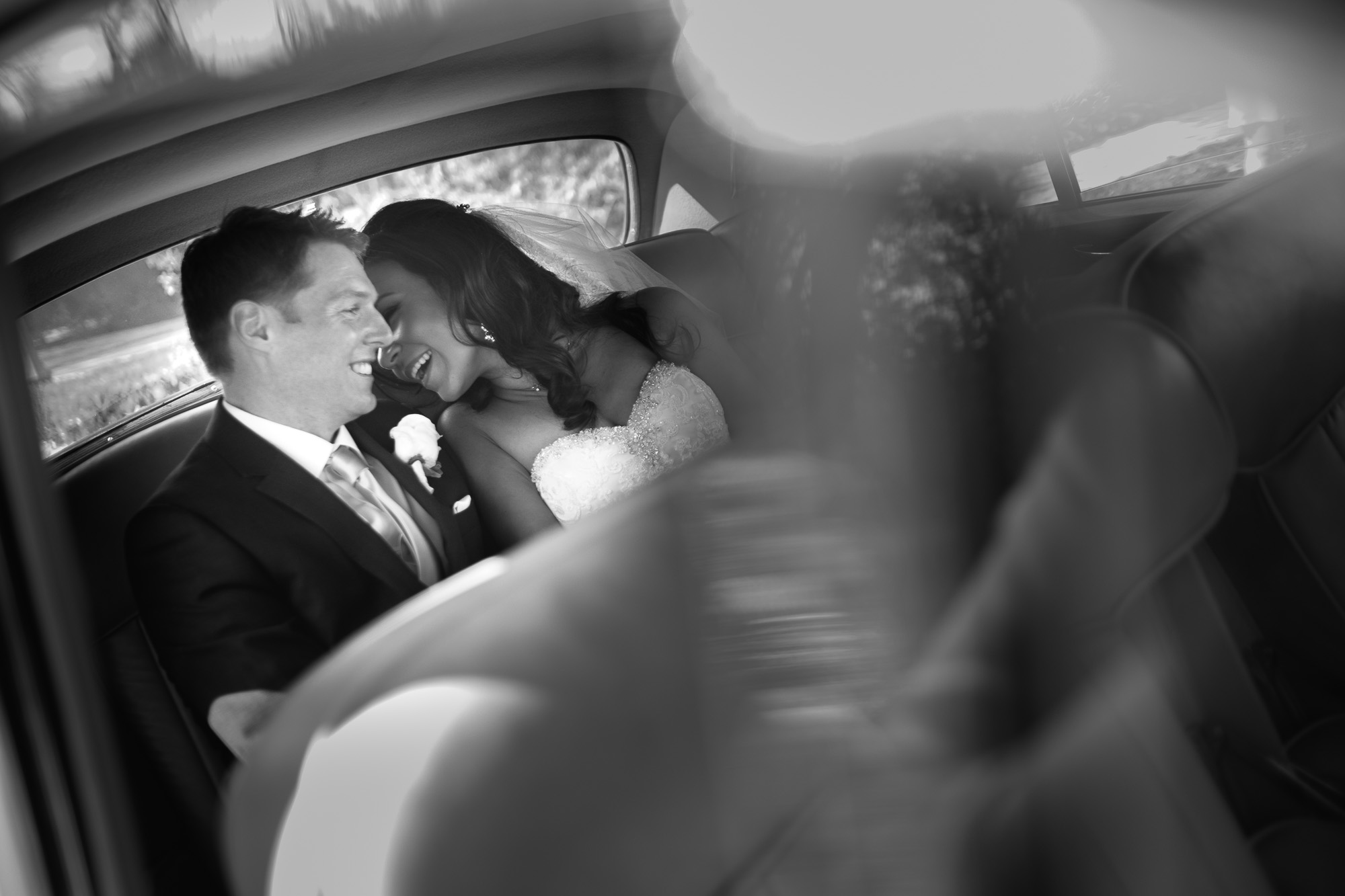  Laura and Chris share a moment during wedding portraits in a vintage car at the Paletta &nbsp;Mansion.&nbsp; 