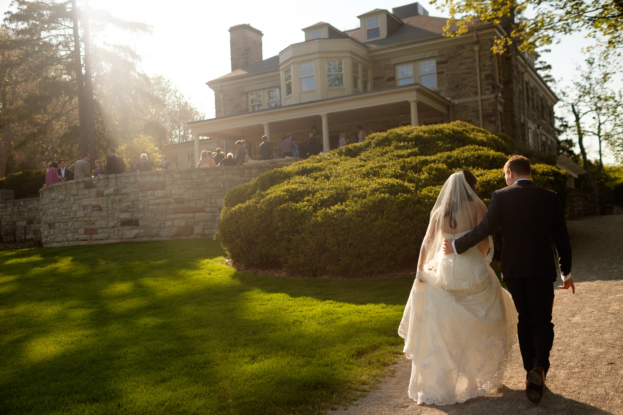  A wedding photograph of the bride and groom as the walk back to their reception at the Paletta Mansion in Mississauga. &nbsp; 