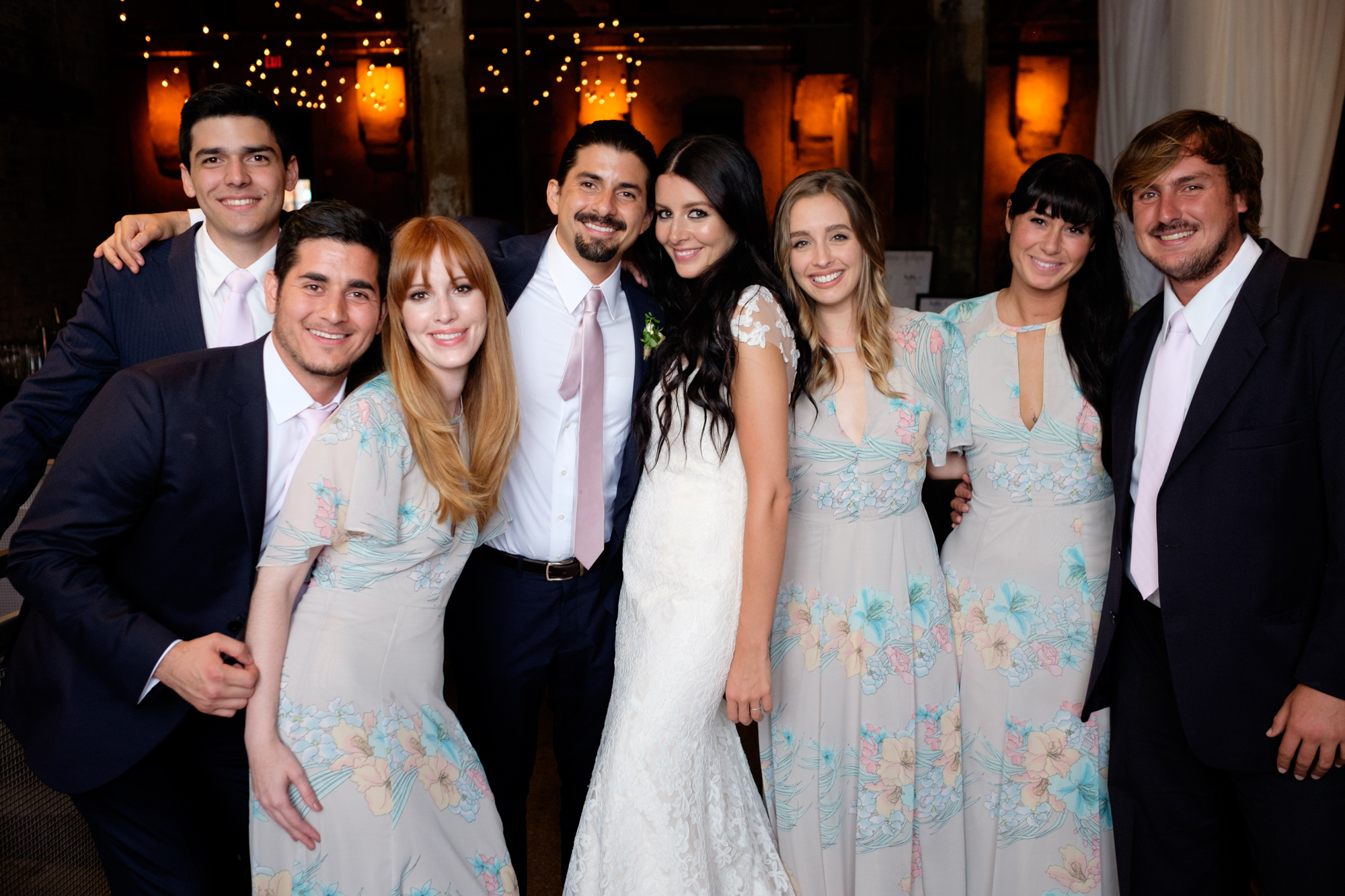 The wedding party poses for a portrait in Toronto's Fermenting Cellar.