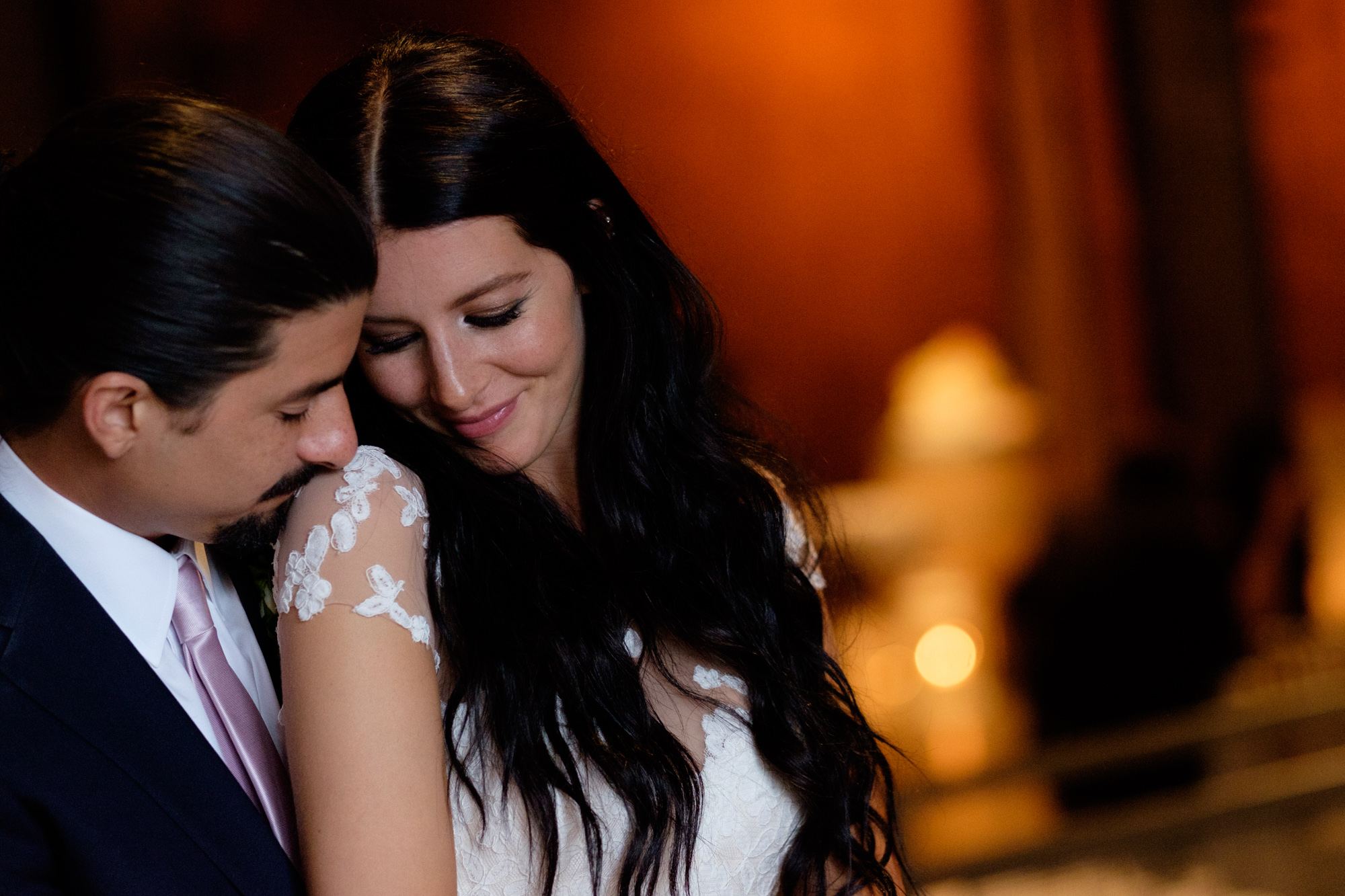 Danni + Felipe pose for a wedding portrait at the entrance to the Fermenting Cellar.