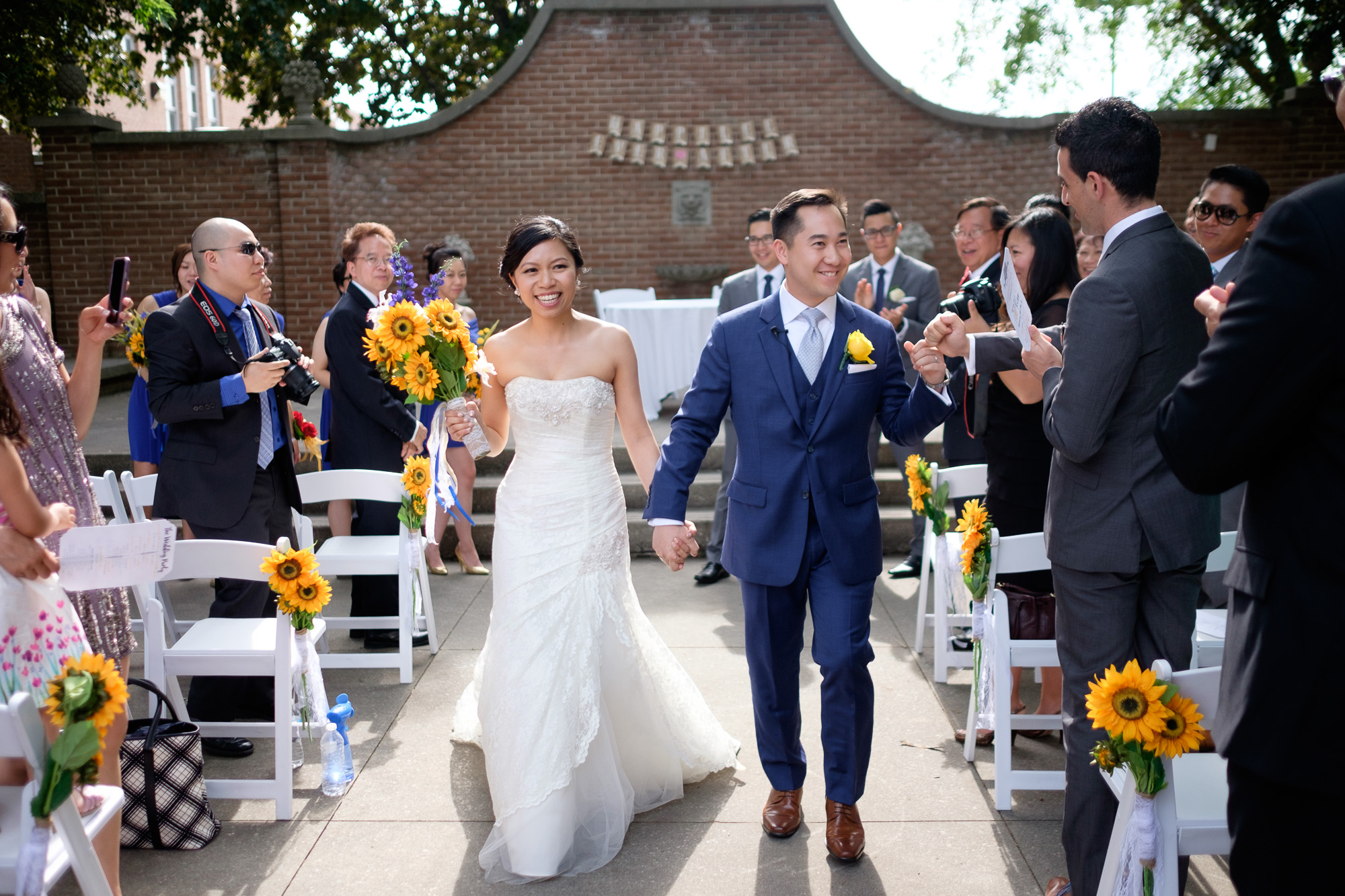  Sherry and Jonathan are congratulated by their family and friends as they walk down the aisle as a newly married couple after their wedding ceremony in Toronto. 