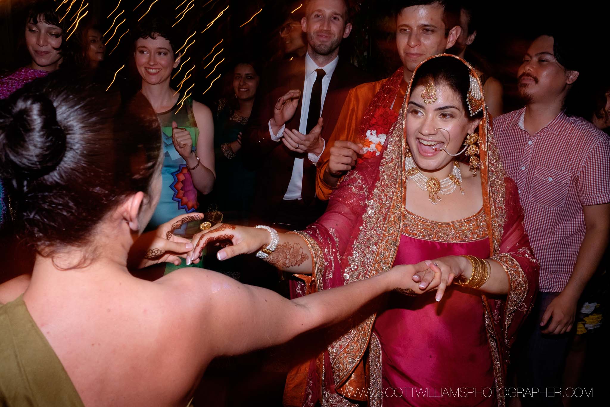  The bride dances with guests during the wedding reception of her backyard wedding in Burlington, Ontario. 
