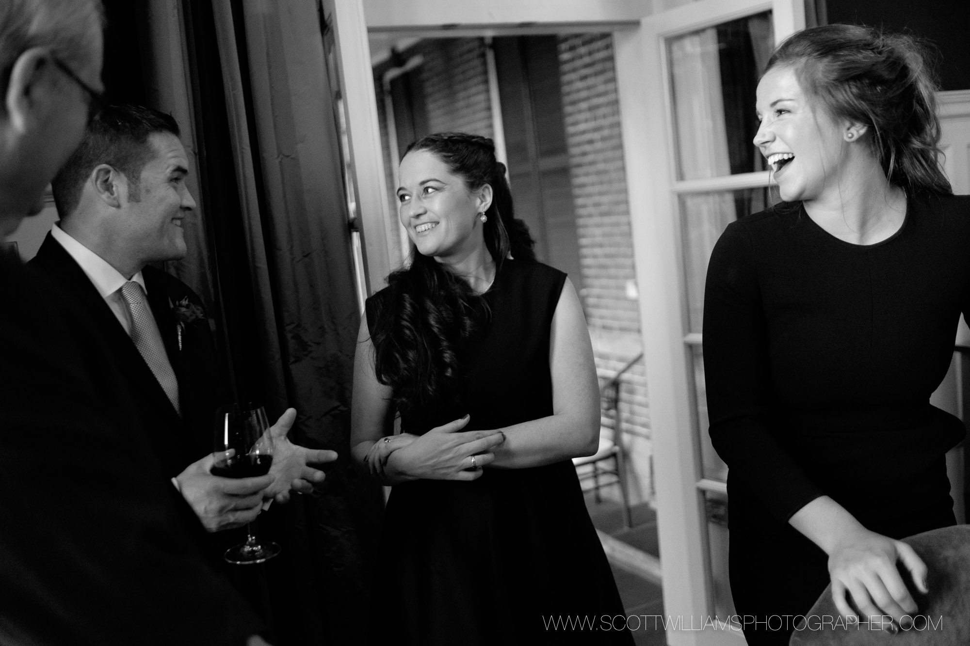  A candid black and white photograph of guests at a small, intimate wedding at Langdon Hall in Cambridge, Ontario.&nbsp; 