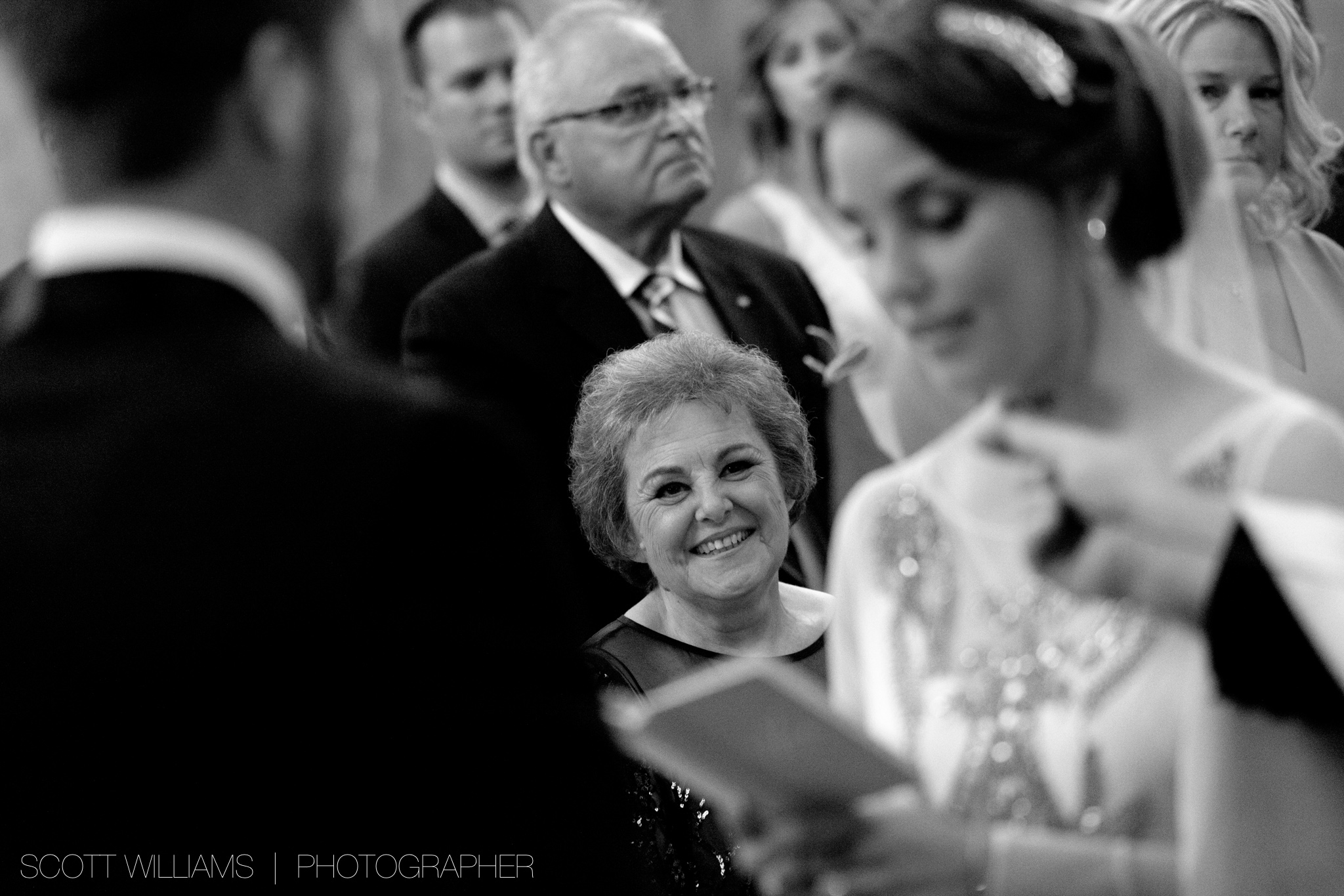  Christina's mother looks on as she and Tim exchange personal wedding vows during their Ukrainian wedding ceremony in Toronto. 
