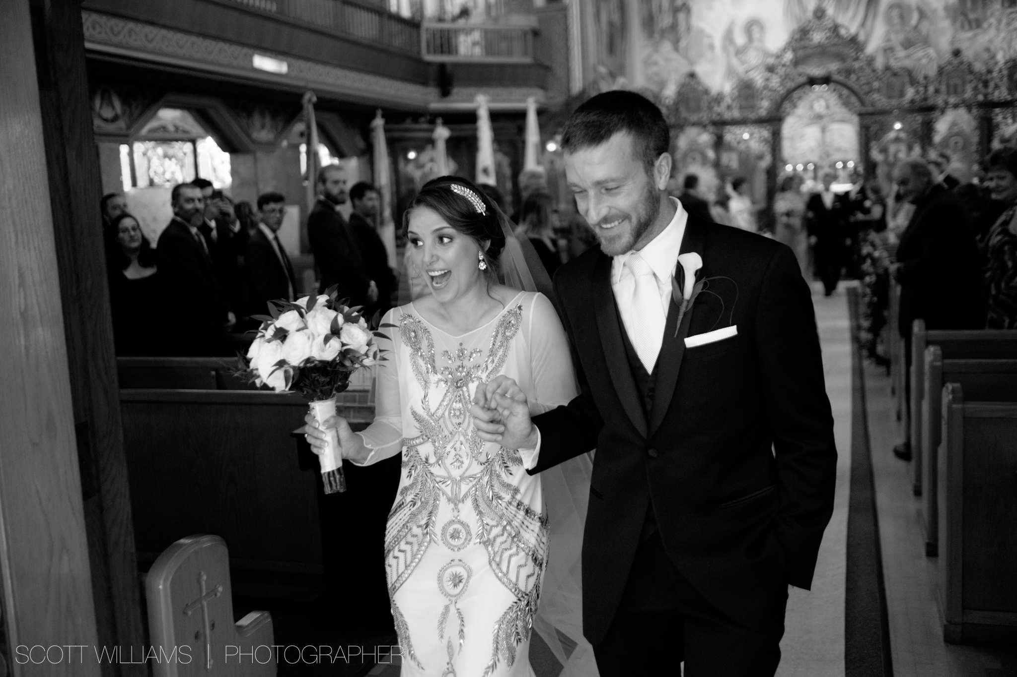 Christina and Tim are all smiles after walking down the aisle as husband and wife after their Ukrainian wedding ceremony in Toronto.