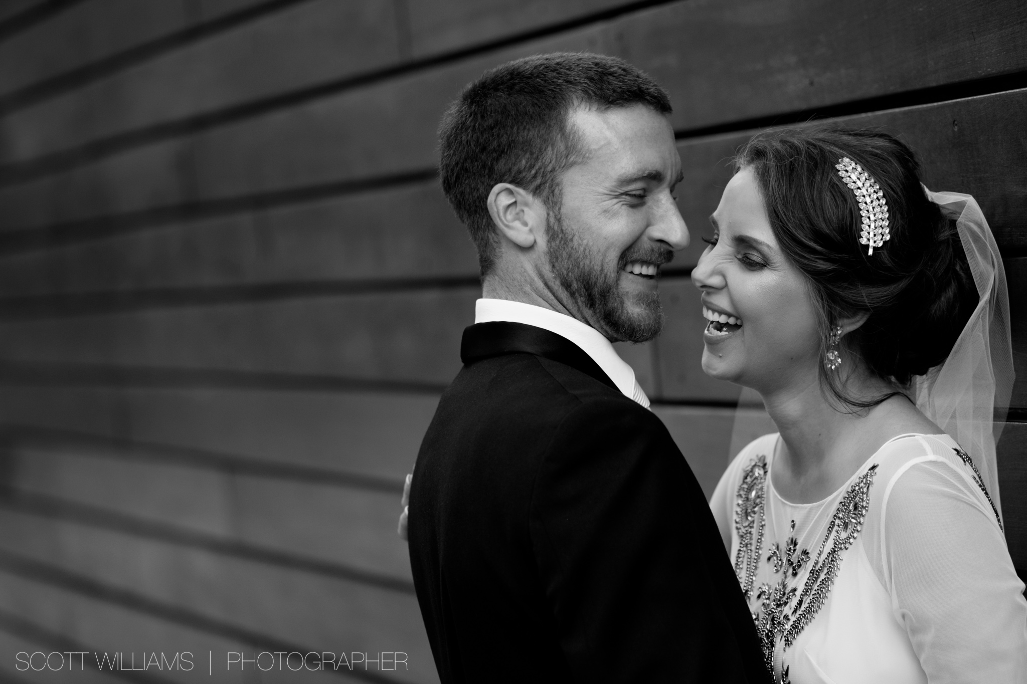  Christina &amp; Tim share a laugh while posing for wedding portraits during their wedding at Malaparte in Toronto. 