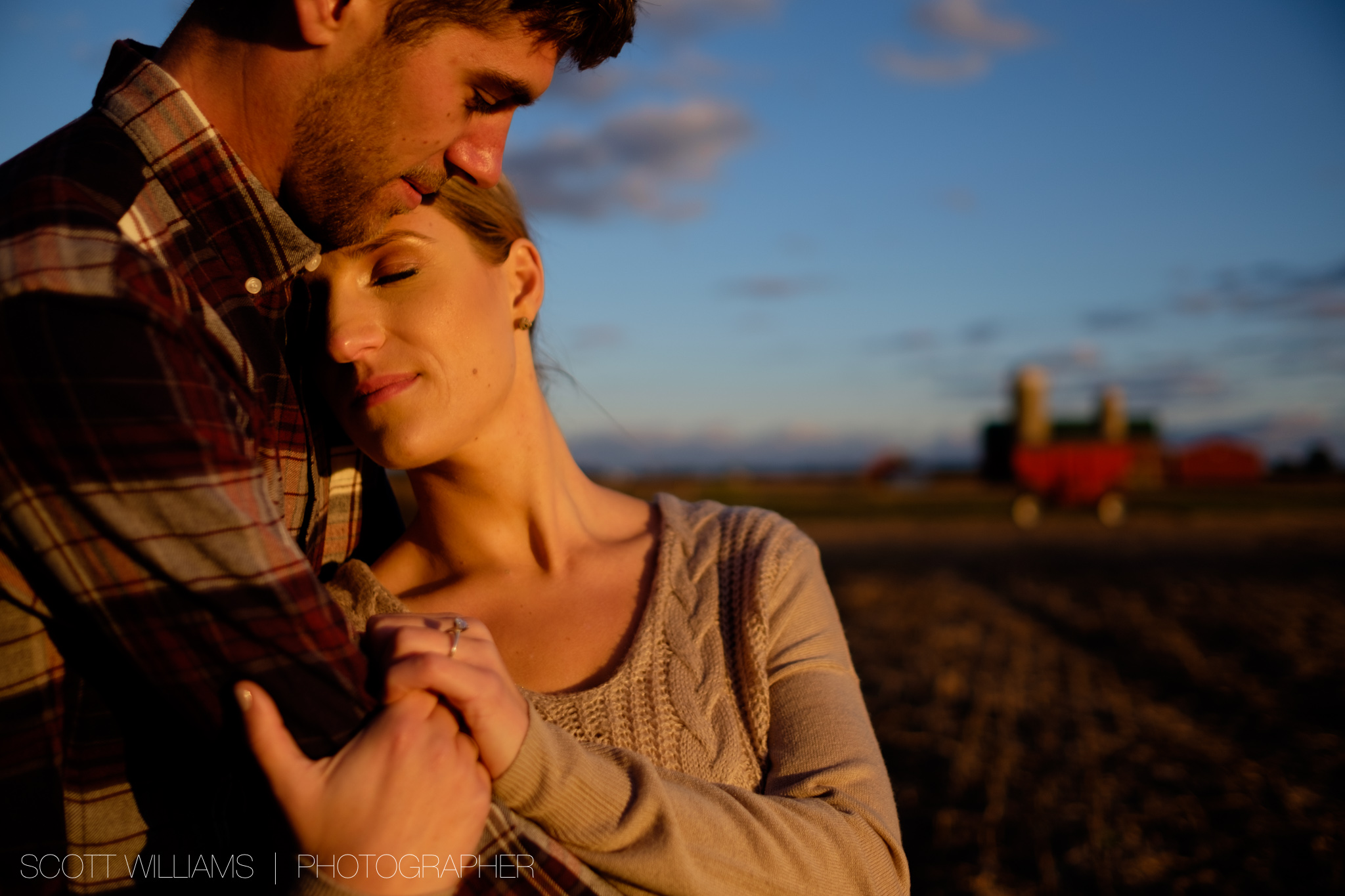  A photograph from Sabrina + Zach's sunset engagement session on a farm in Southwestern Ontario. 