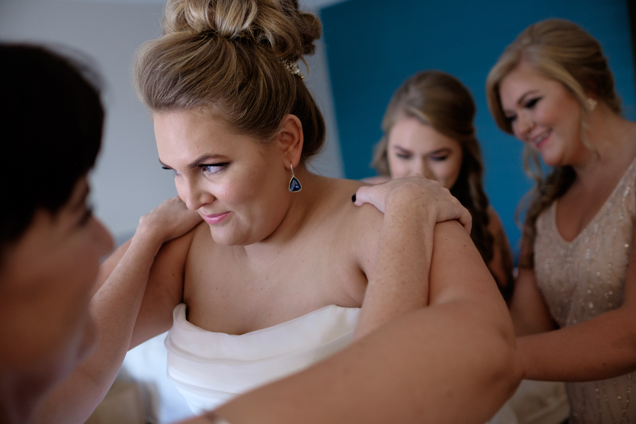 Bride get's her wedding dress on in a suite at the Radisson Admiral in downtown Toronto before the wedding at SteamWhistle Brewery in Toronto.