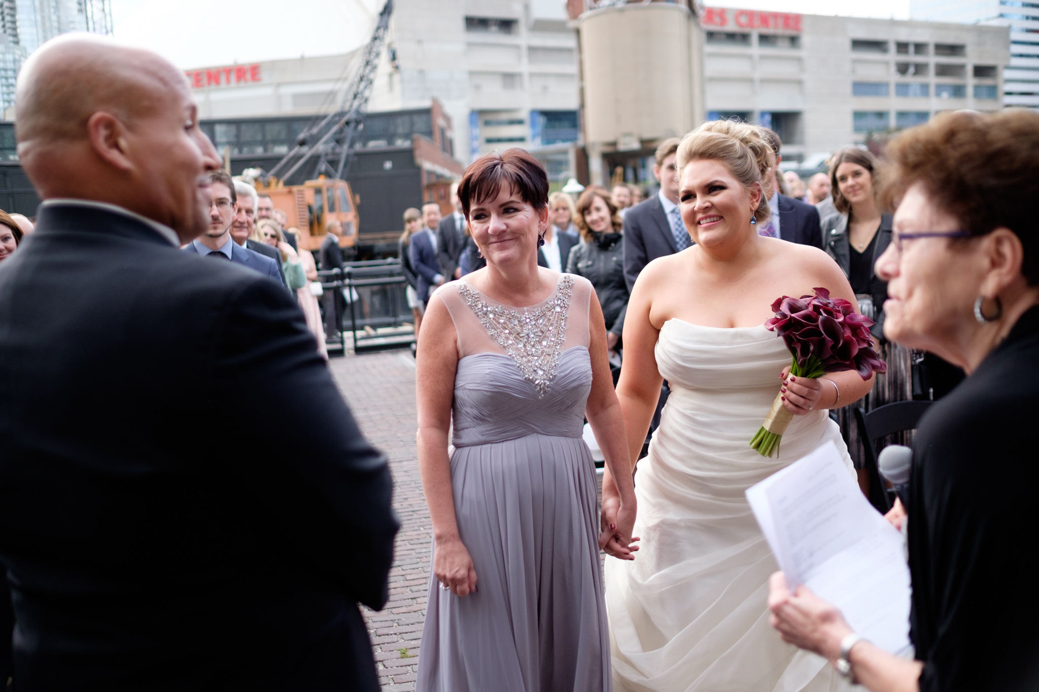  Savannah + Bernie share a moment after she walked up the aisle during their wedding at SteamWhistle Brewery in downtown Toronto.&nbsp; 