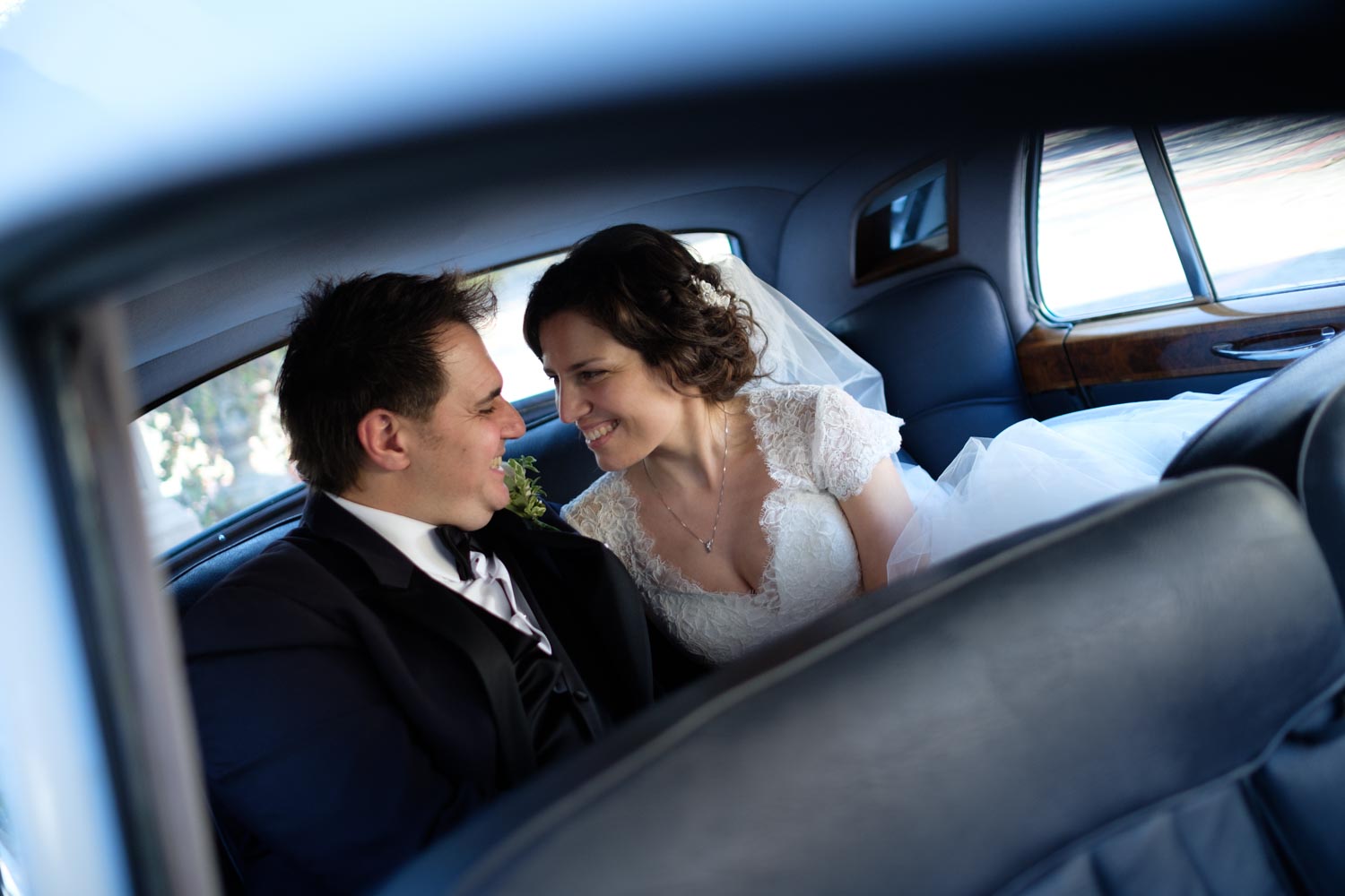  A wedding portrait inside a classic limousine at Graydon Hall in Toronto, 