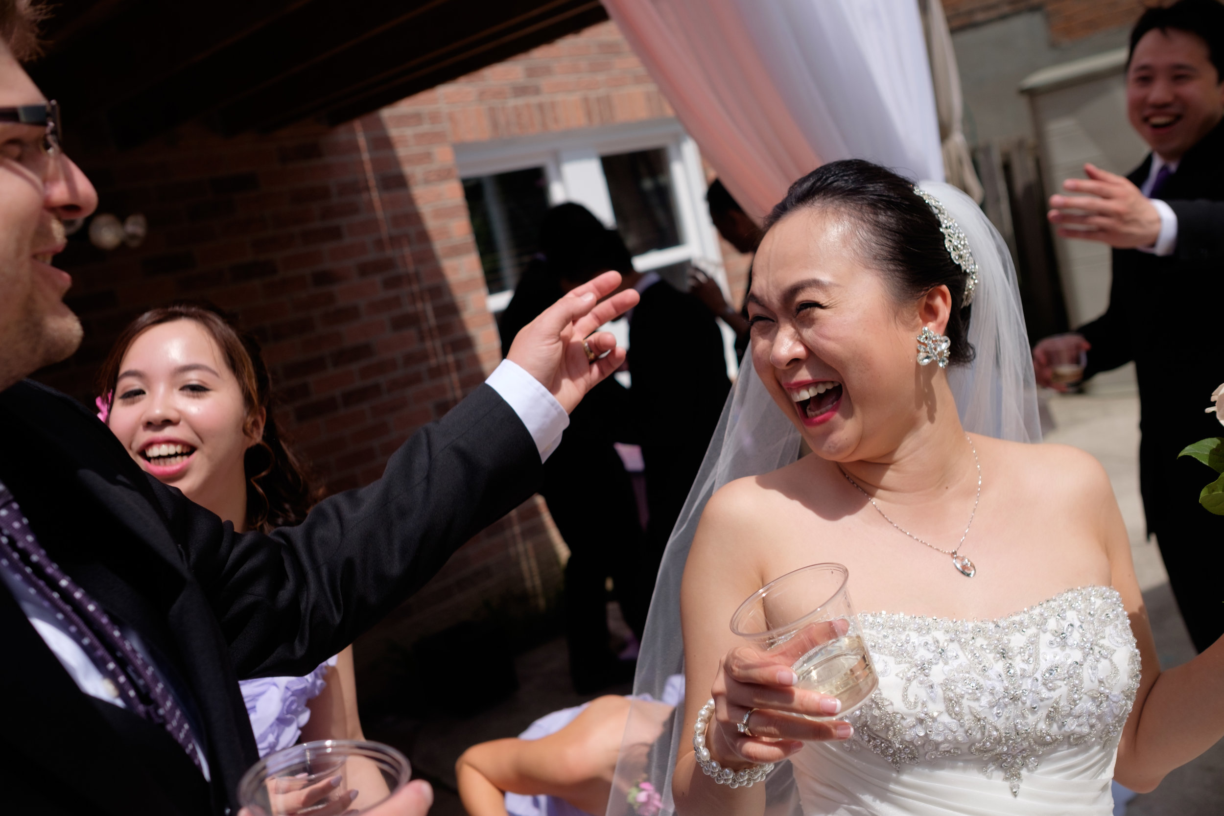  Love the joy and laughter on Jing's face after their backyard wedding ceremony in Toronto. 