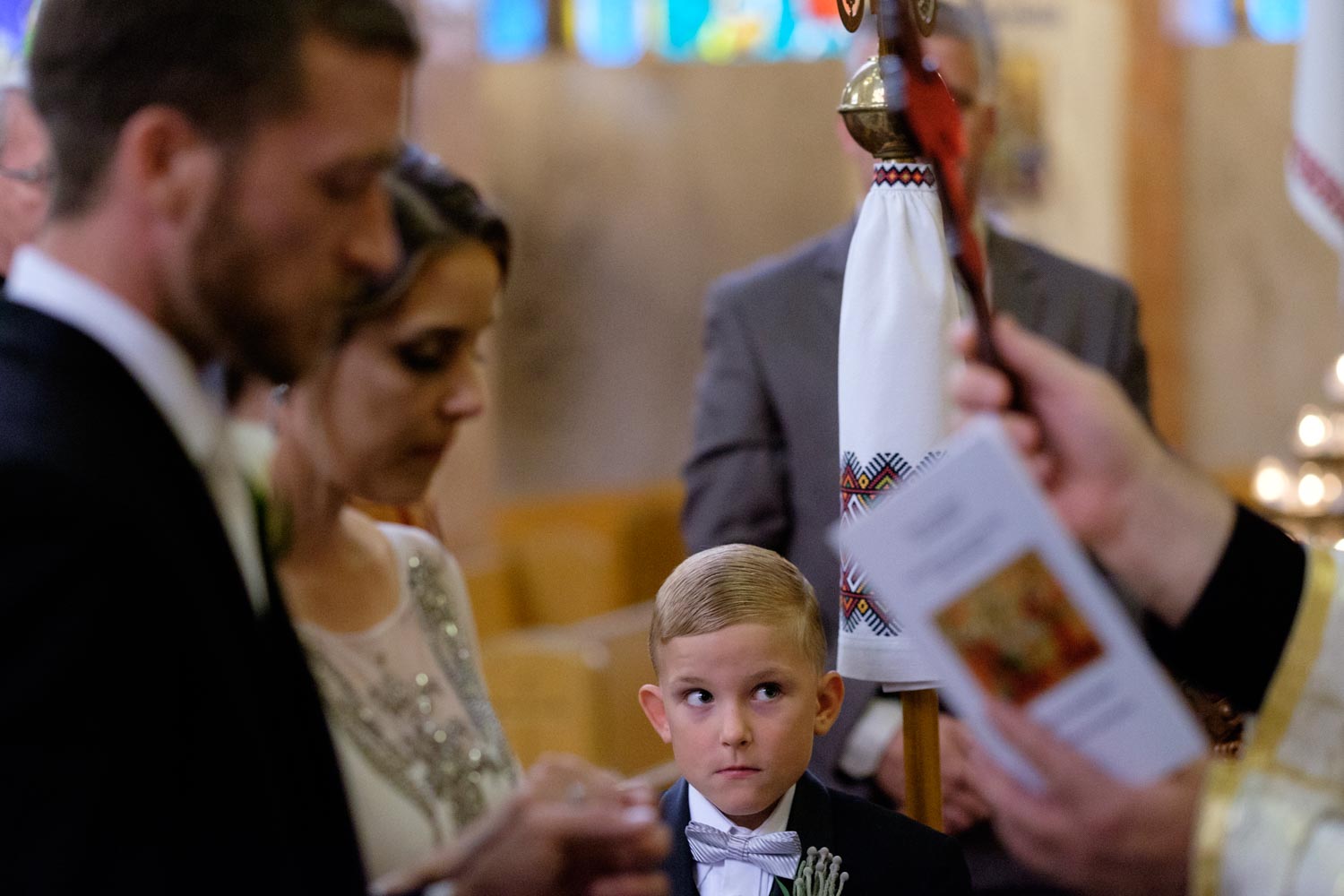  In my mind, this kid is thinking 'Dude, don't do it... girls are gross!' but him and his brother were two of the best behaved ring bearers I've ever seen. &nbsp; &nbsp;The stood still and kept quiet even during a long Orthodox ceremony... better the