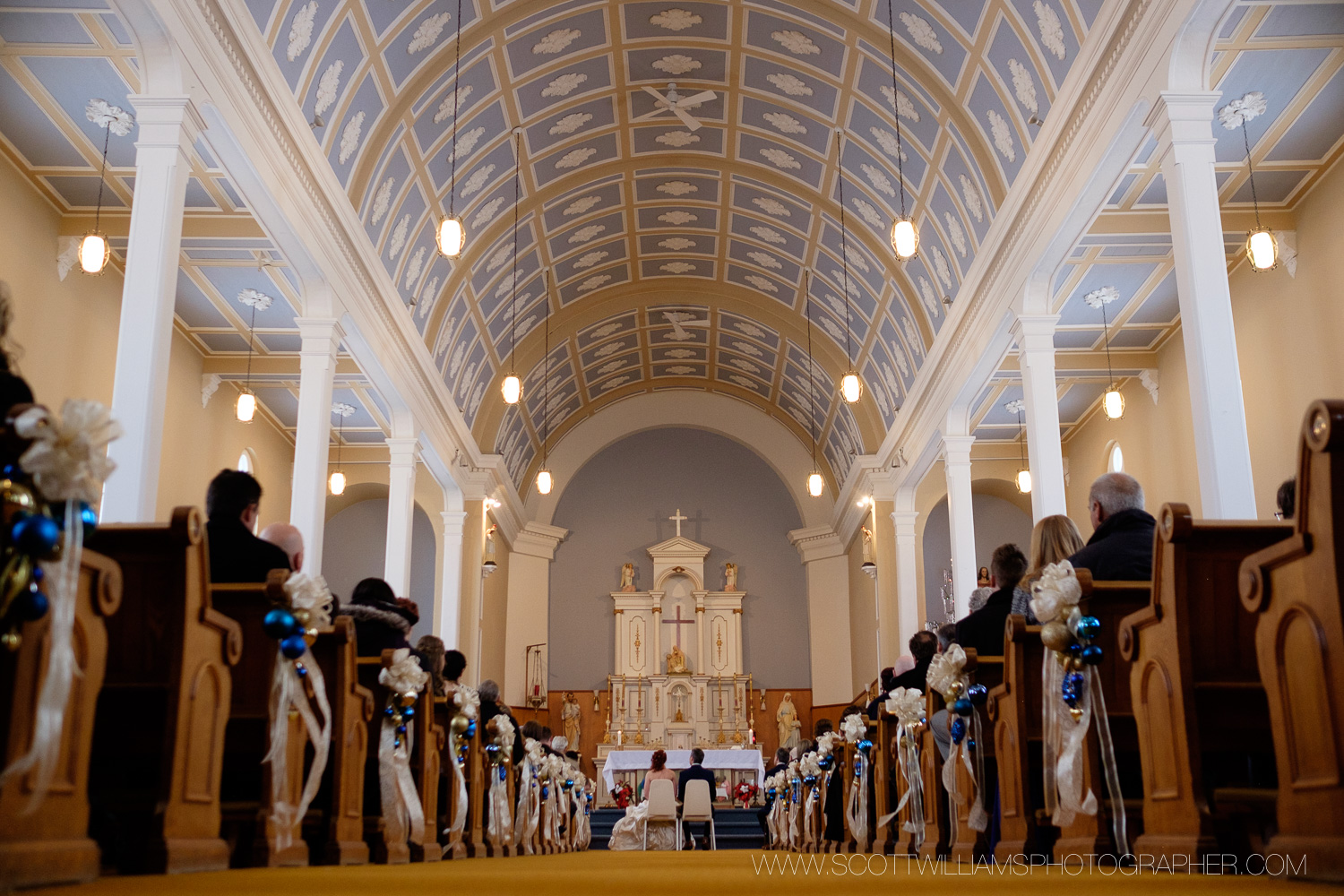  A wide angle photograph from the back of the church during a wedding ceremony in North Bay, Ontario. 