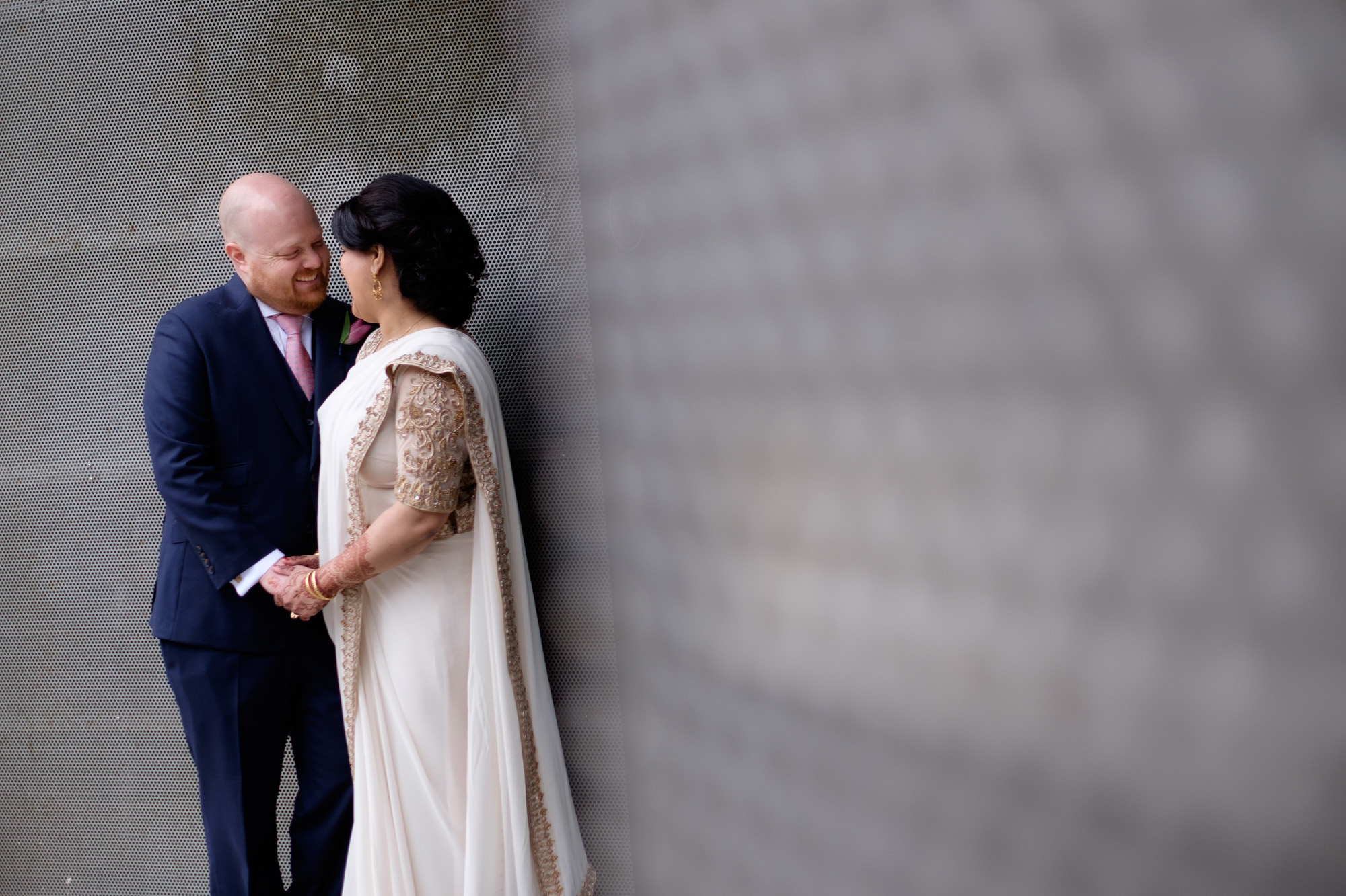  Noor and John pose for a wedding portrait on the streets of Toronto before their wedding ceremony at the Toronto Reference Library. 