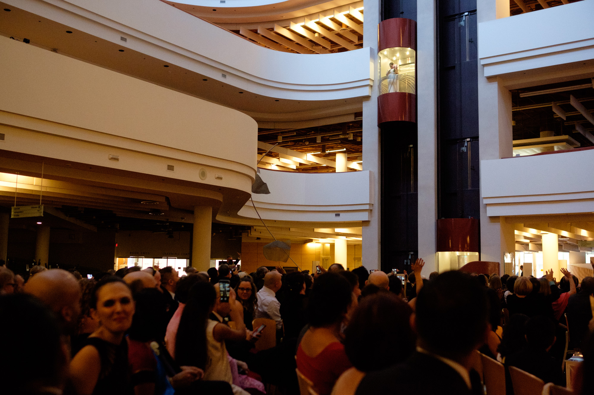 Noor makes a grand entrance as she descends in a glass elevator to her wedding ceremony in the atrium of the Toronto Reference Library. 
