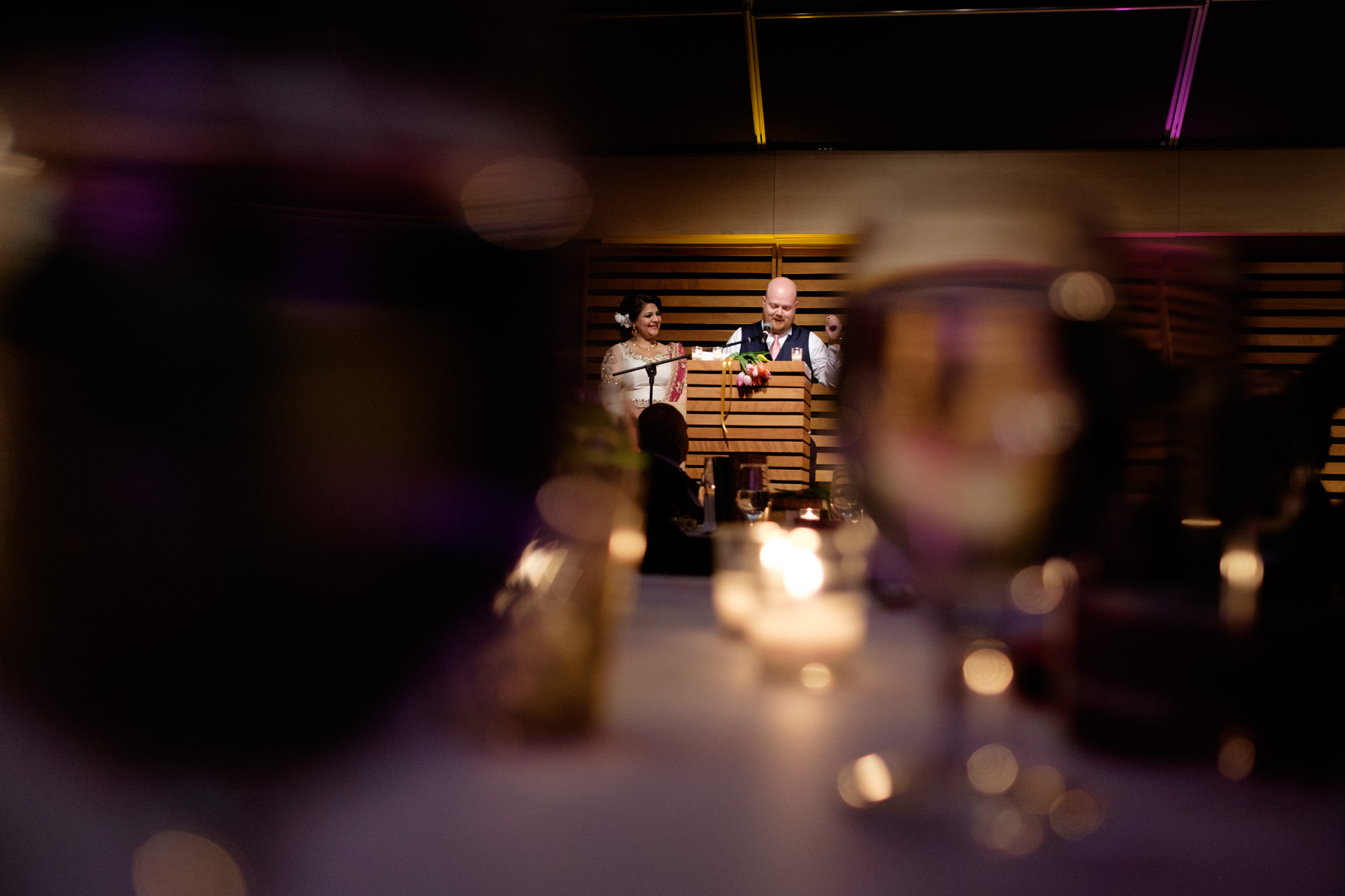 Noor and John give a heartfelt wedding toast to their guests during their wedding reception at the Toronto Reference Library .