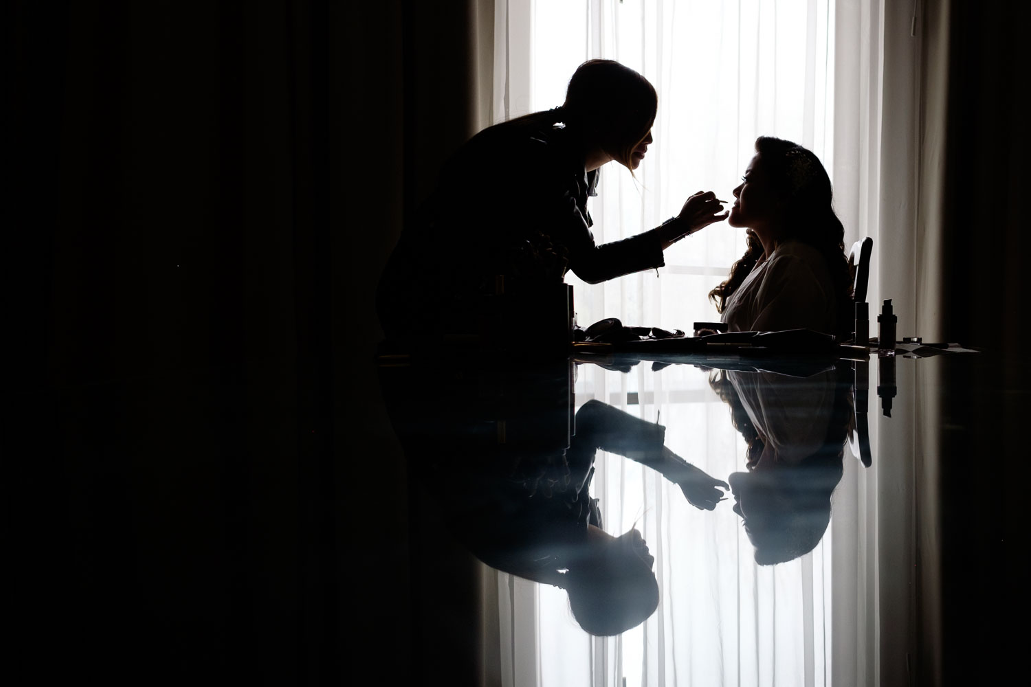  Helen has her makeup applied in the suite at the Delta Hotel before their wedding at the Guild Inn Estate in Toronto. 