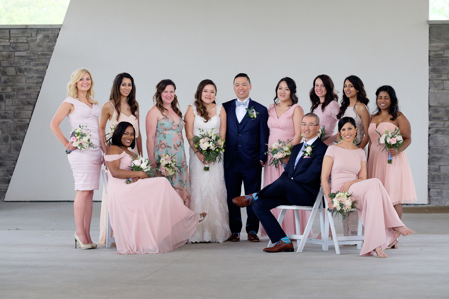  Helen + Nelson pose for a group portrait with their wedding party at the Guild Inn Estate in Toronto.&nbsp; 